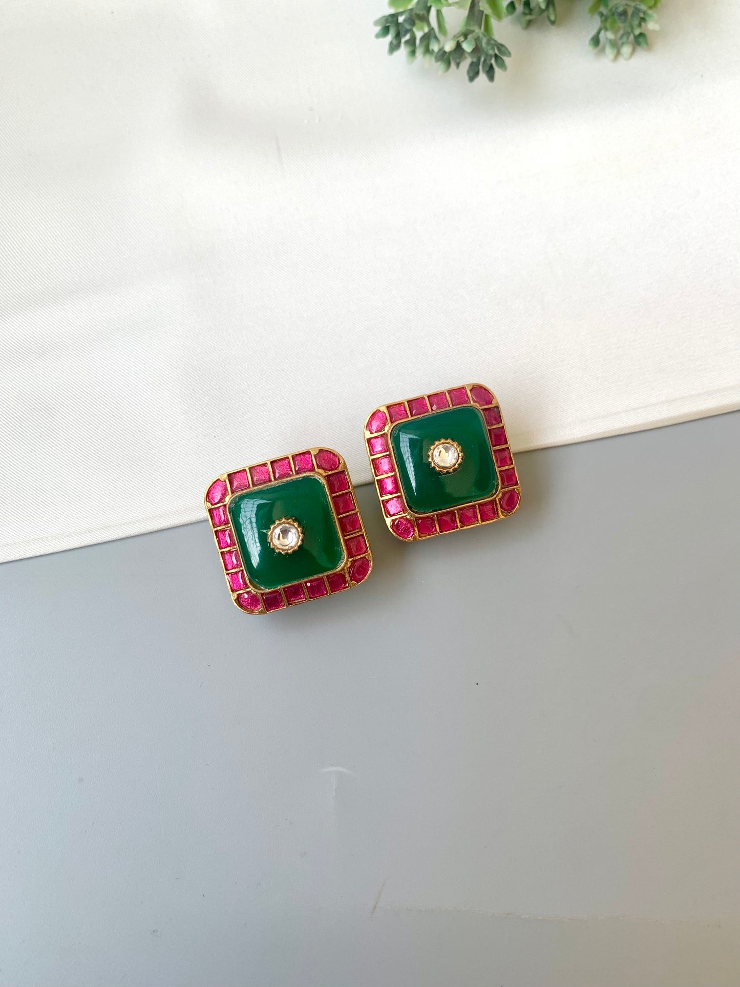 Sofi ruby moissanite kundan studs in victorian gold plating with emerald accents