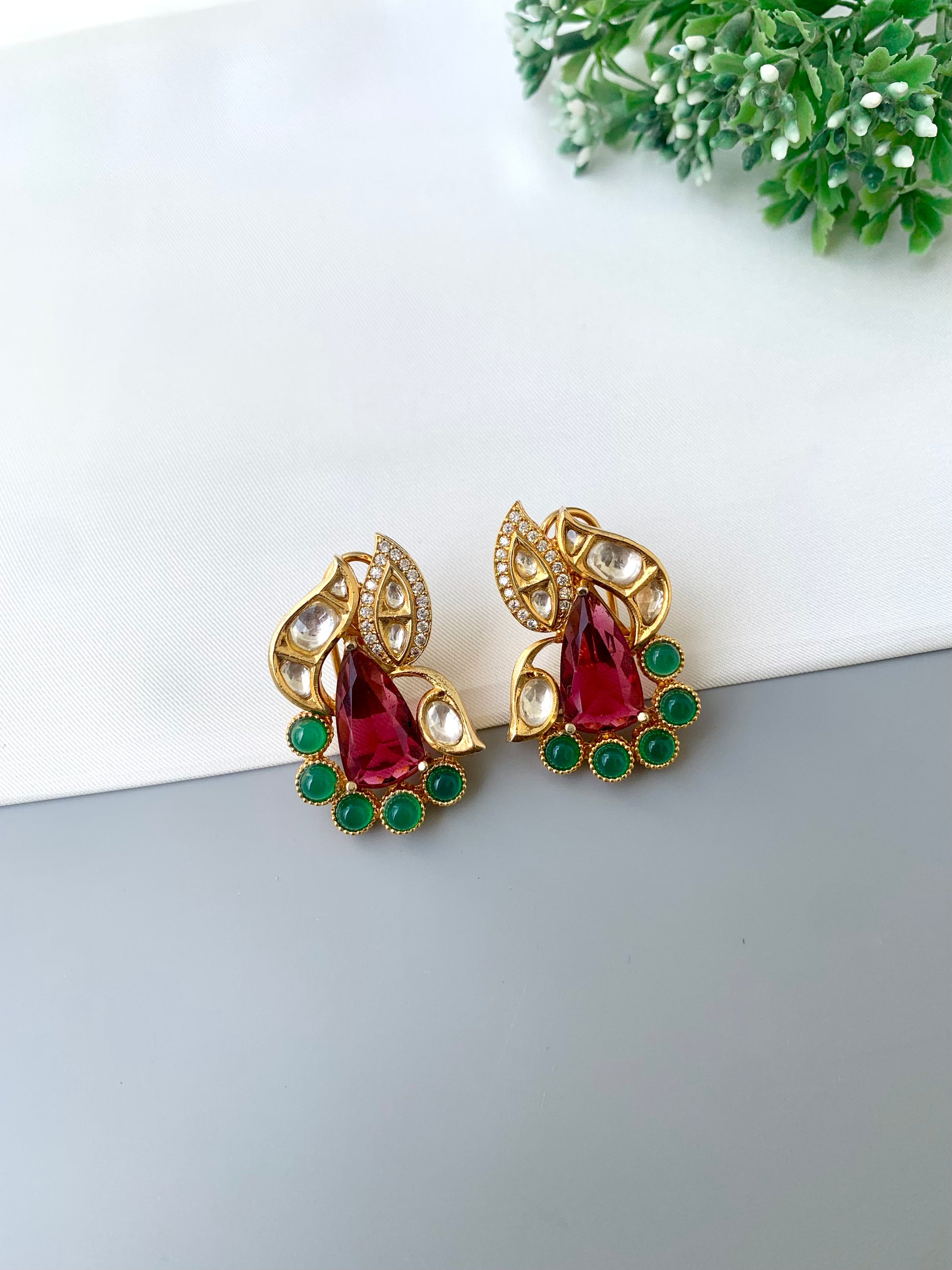 Usha gold plated studs with polki kundan American diamonds ruby and emerald accents