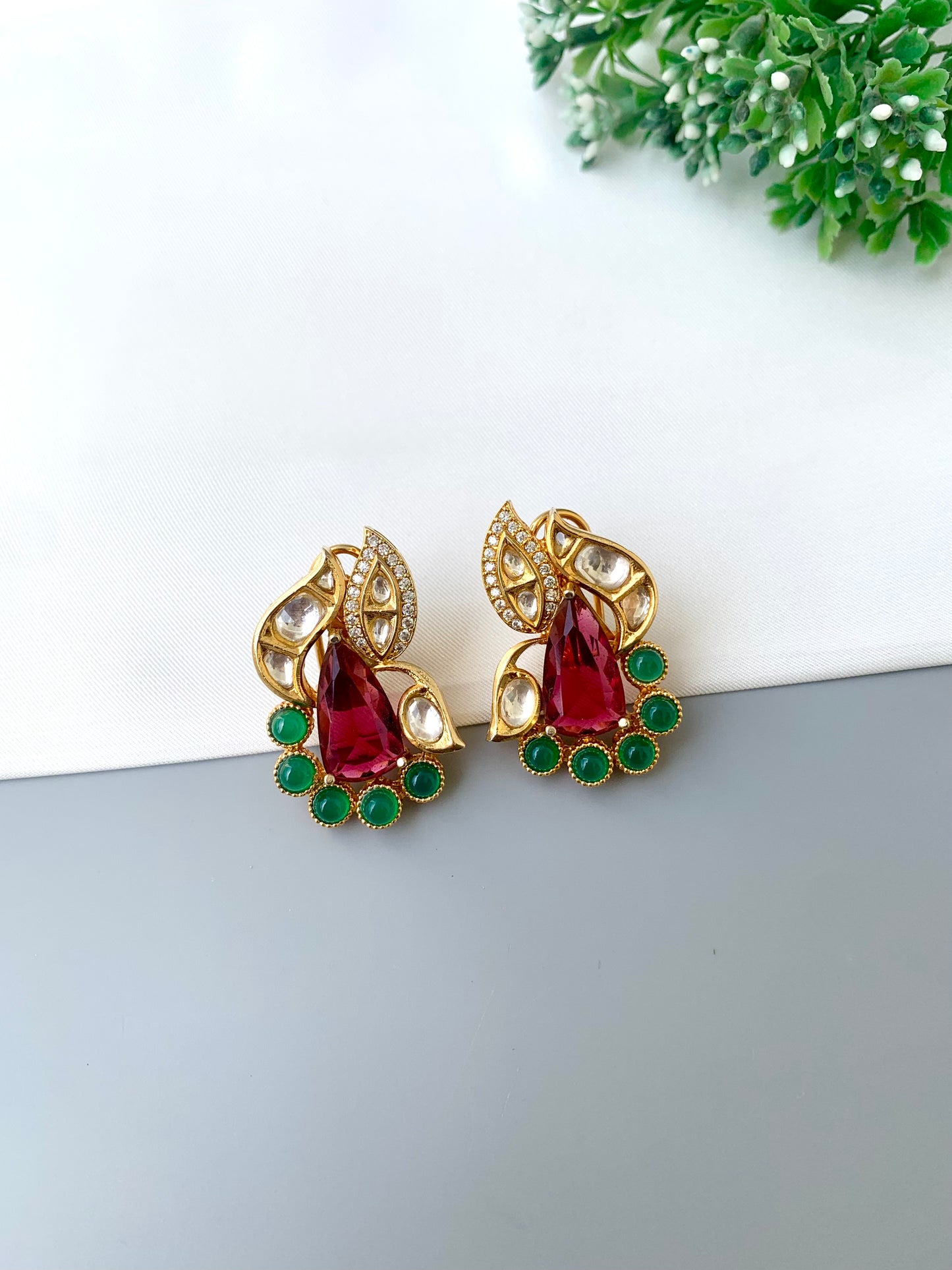 Usha gold plated studs with polki kundan American diamonds ruby and emerald accents