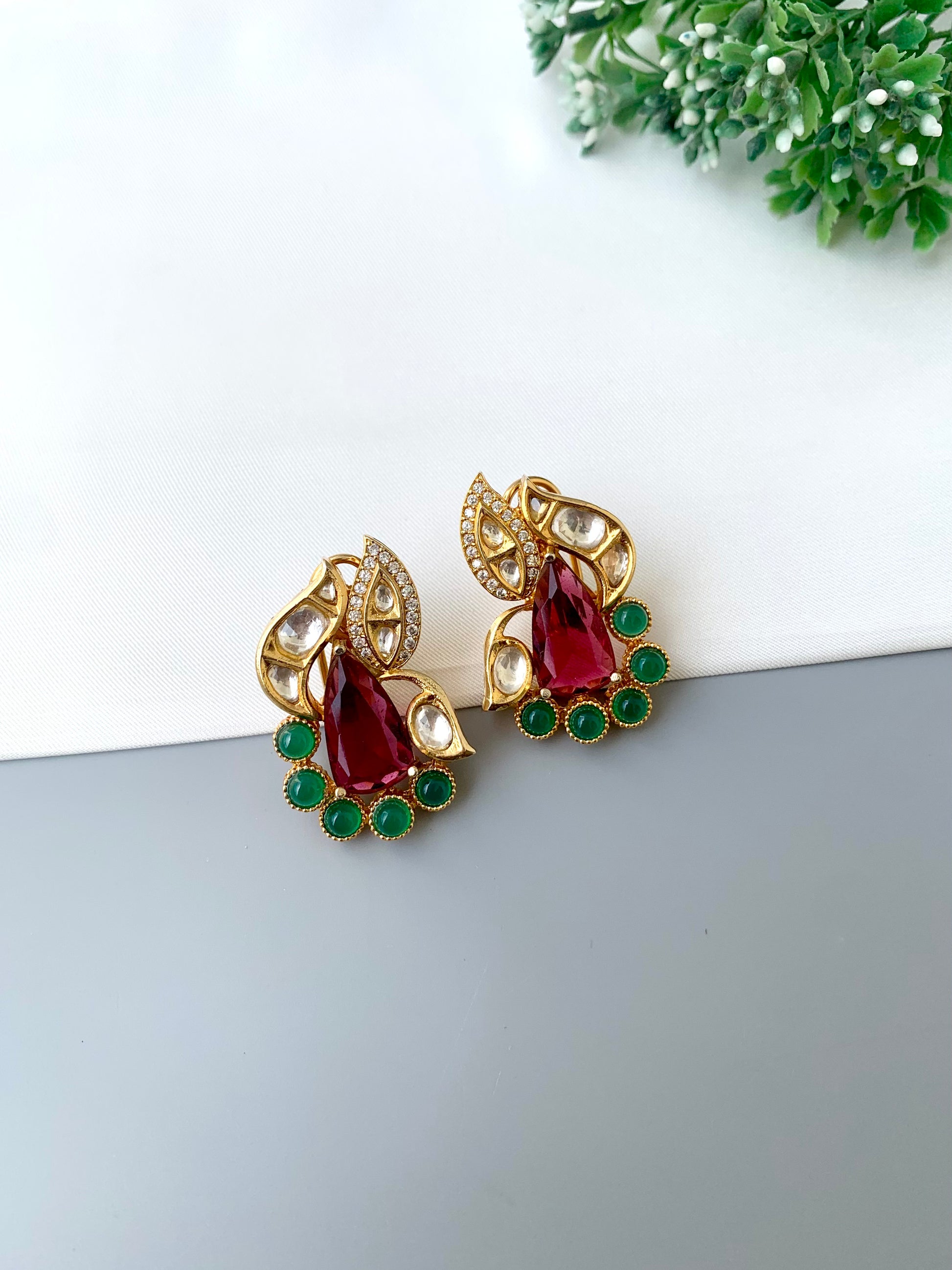 Usha gold plated studs with polki kundan American diamonds ruby and emerald accents