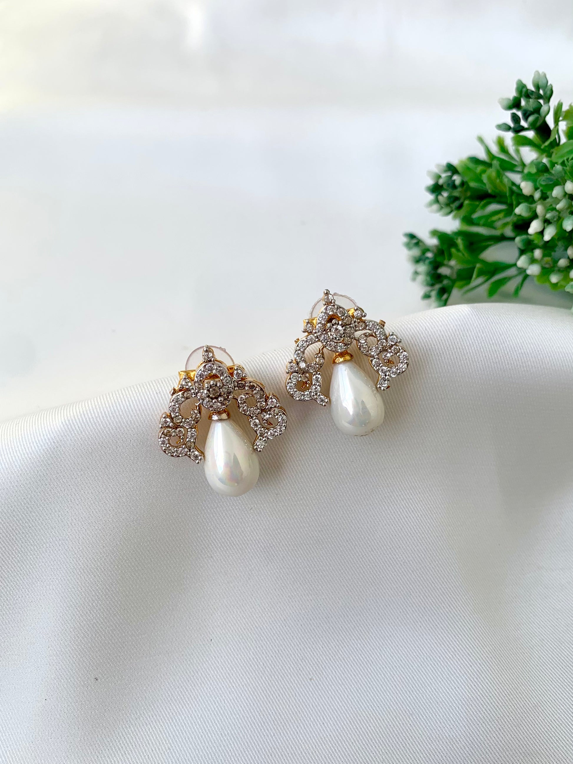 Veeda gold plated earrings with American diamonds and pearl accents