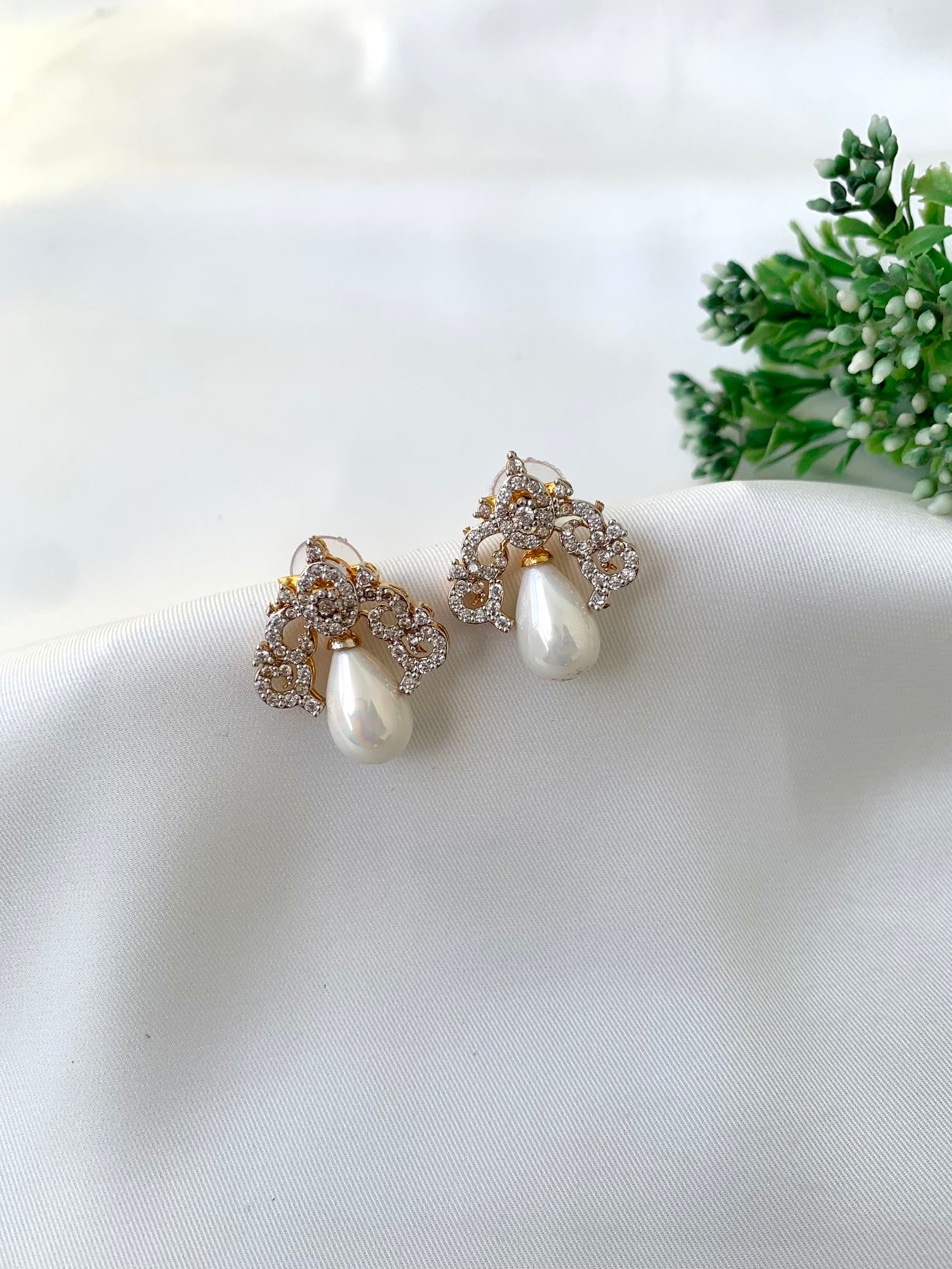 Veeda gold plated earrings with American diamonds and pearl accents