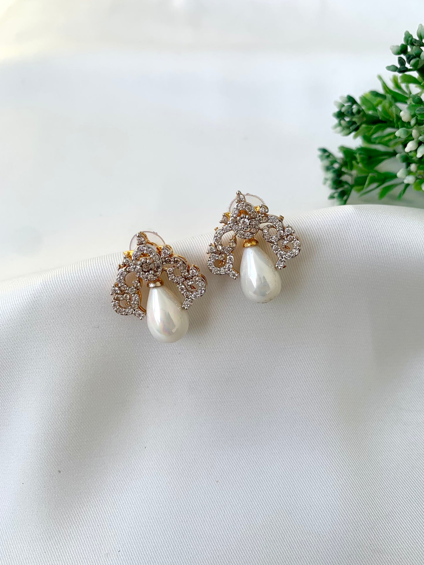 Veeda gold plated earrings with American diamonds and pearl accents