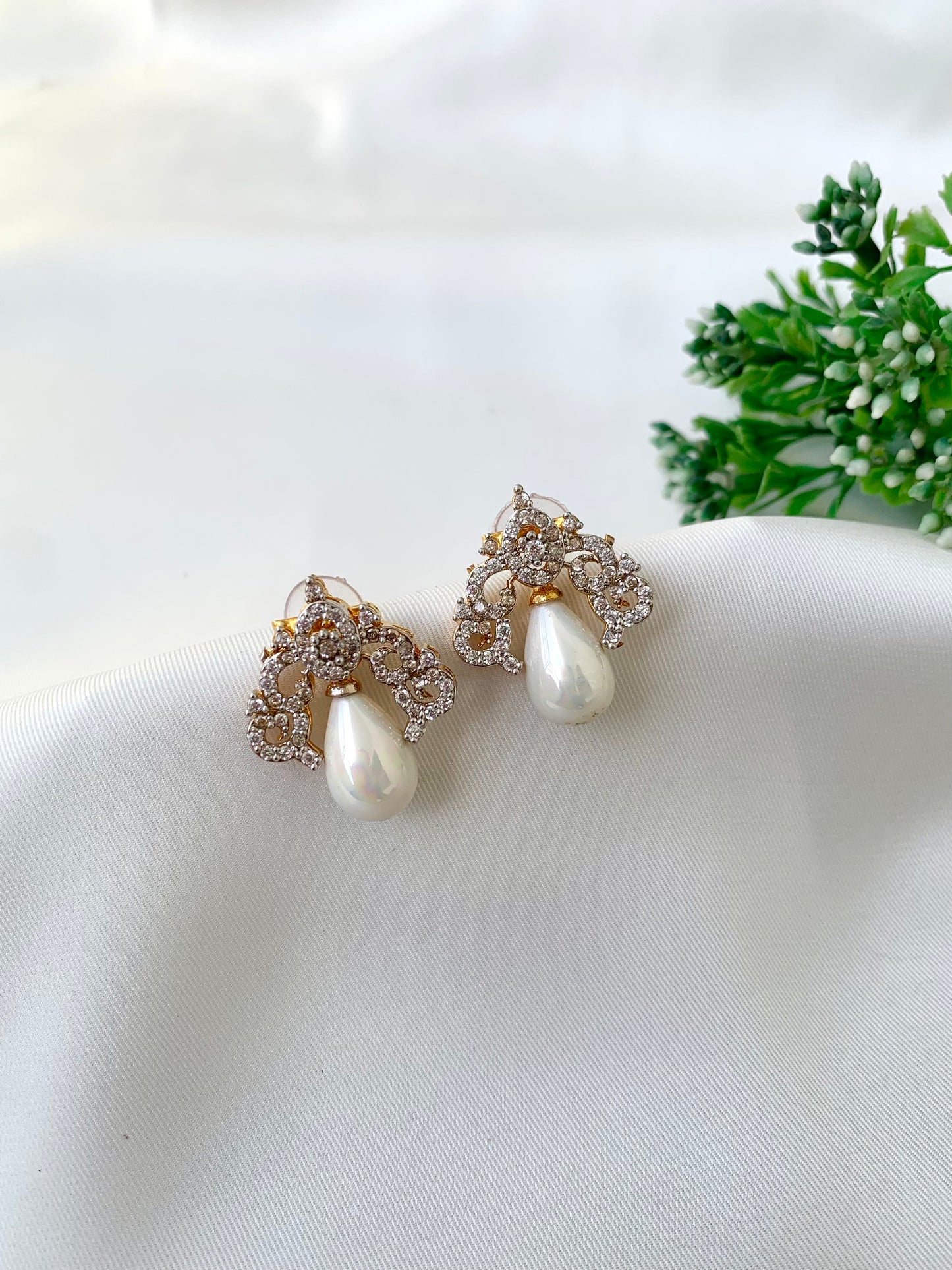 Veeda gold plated earrings with American diamonds and pearl accents