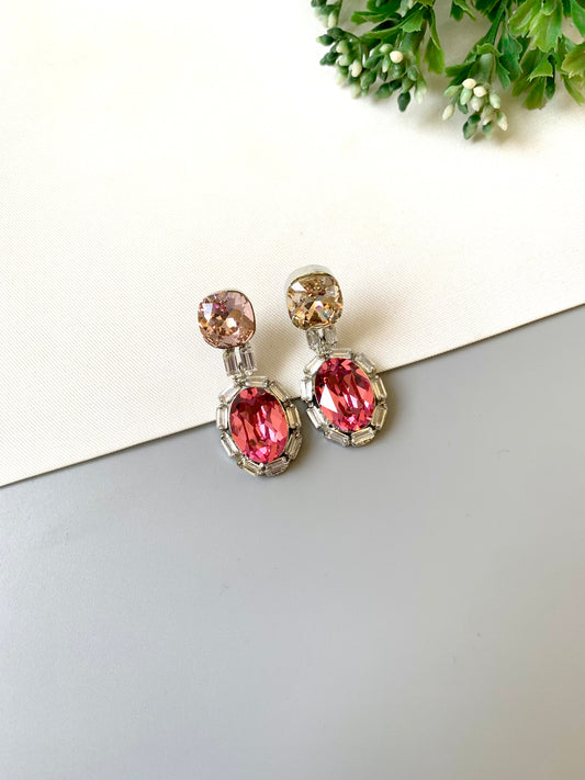 Handcrafted rhodium plated platinum finish earrings with baguette stones and Swarovski crystals in pink tone