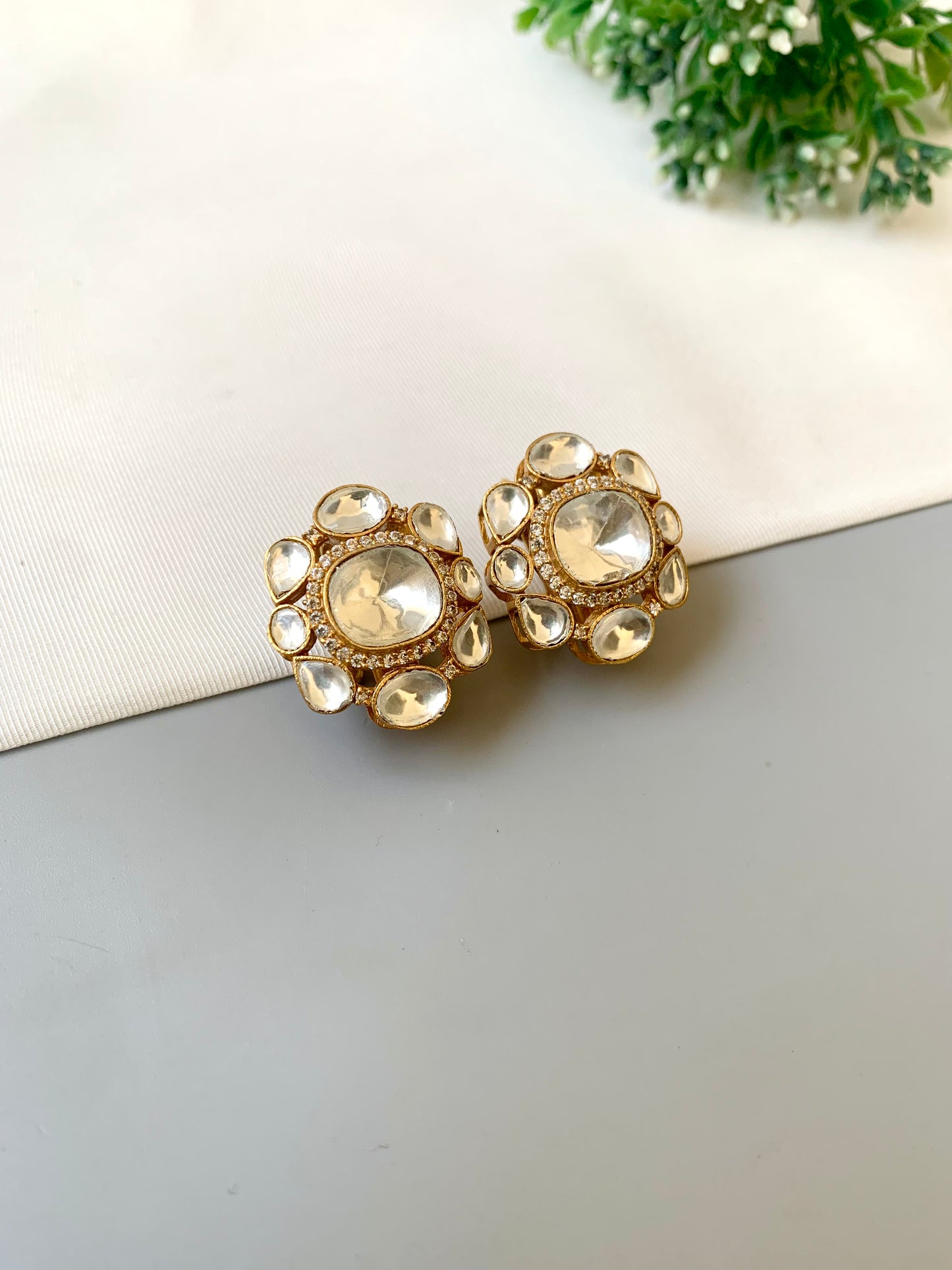 Hand crafted 22kt gold plated studs with American diamonds and moissanite kundan by Zamal