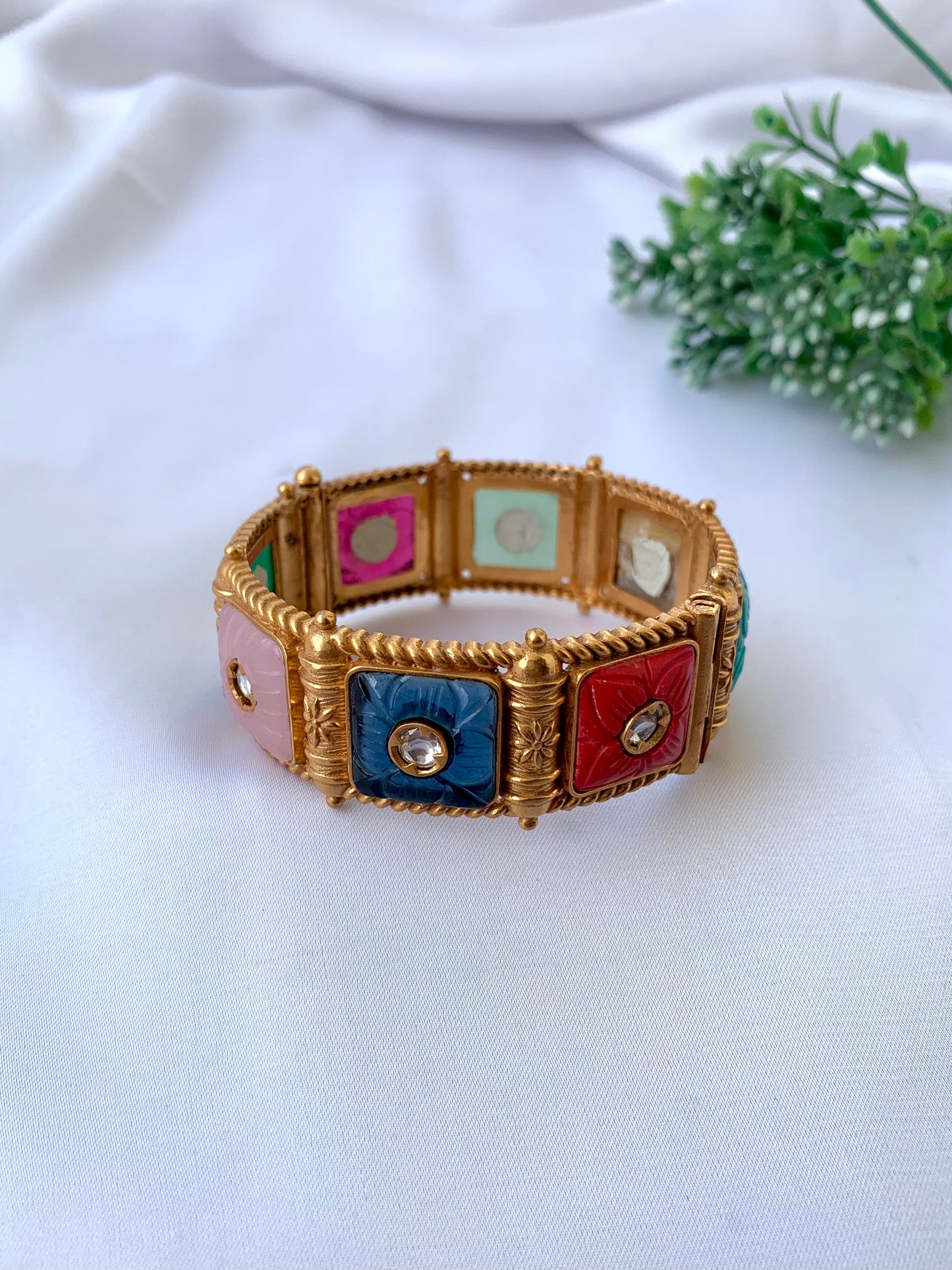 Handcrafted Arzella Bangle in 22kt gold plating with Polki Kundan and hand-carved Sapphire, Ruby, Emerald & Onyx stones