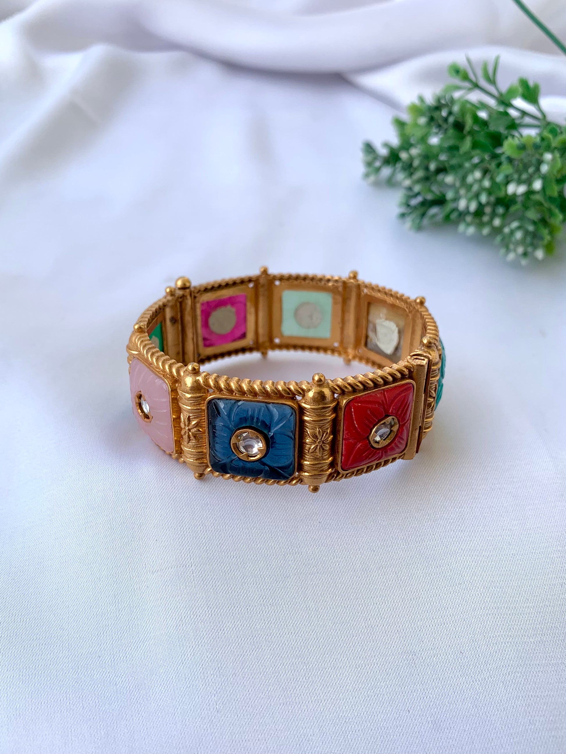 Handcrafted Arzella Bangle in 22kt gold plating with Polki Kundan and hand-carved Sapphire, Ruby, Emerald & Onyx stones