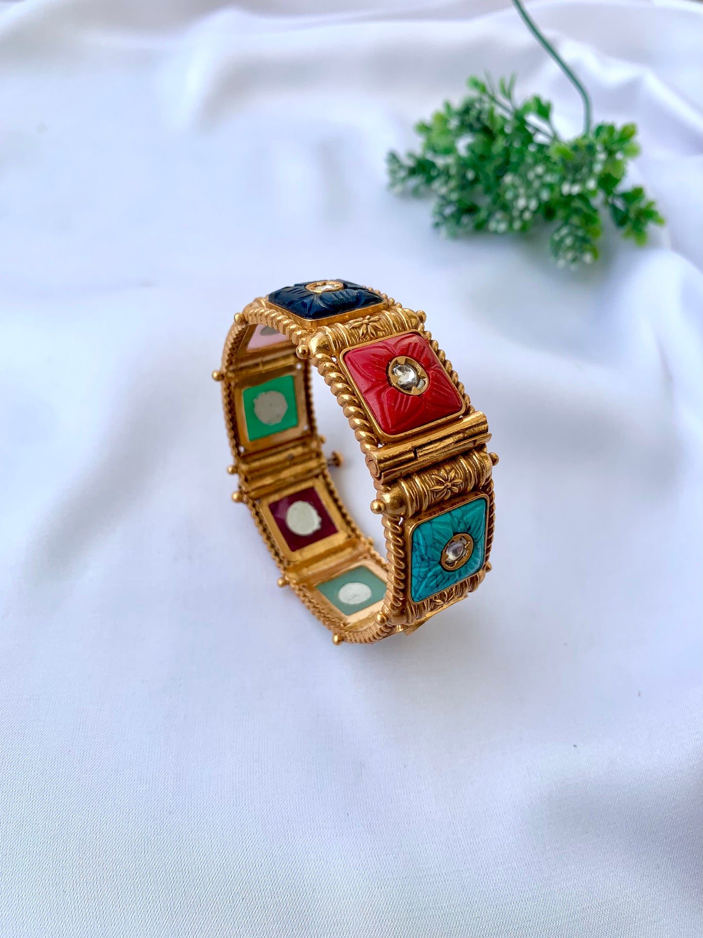 Handcrafted Arzella Bangle in 22kt gold plating with Polki Kundan and hand-carved Sapphire, Ruby, Emerald & Onyx stones