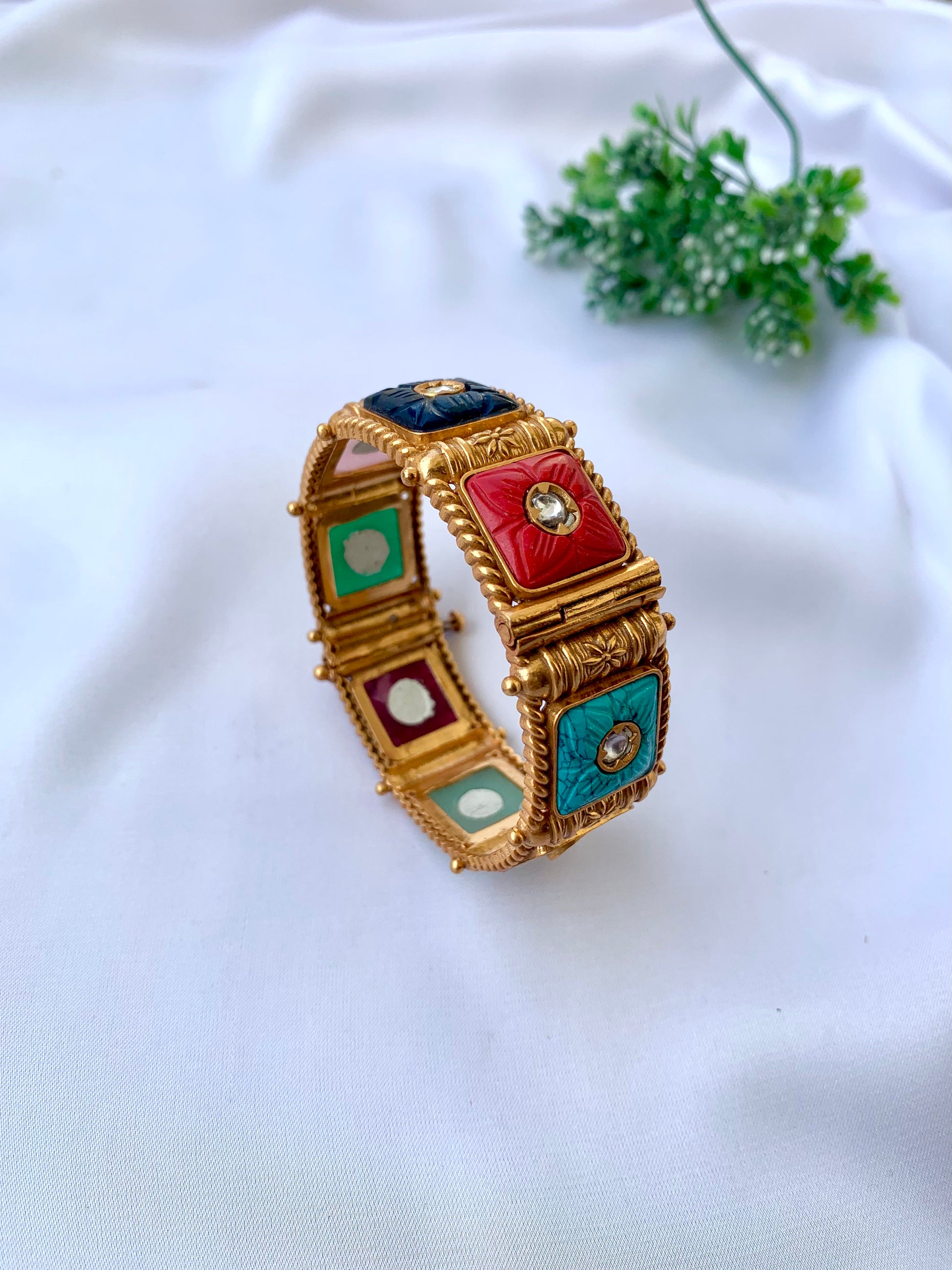 Handcrafted Arzella Bangle in 22kt gold plating with Polki Kundan and hand-carved Sapphire, Ruby, Emerald & Onyx stones
