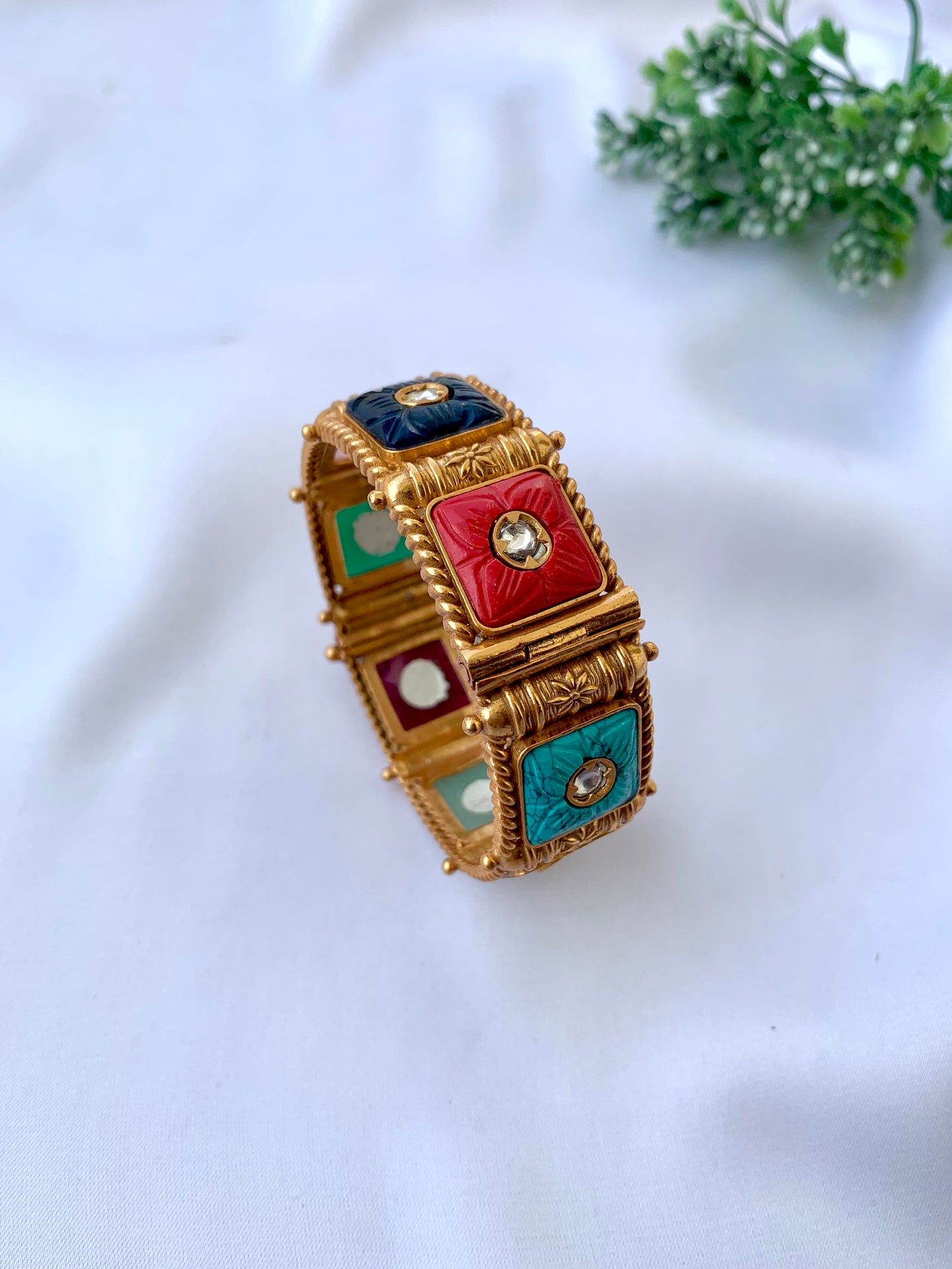 Handcrafted Arzella Bangle in 22kt gold plating with Polki Kundan and hand-carved Sapphire, Ruby, Emerald & Onyx stones