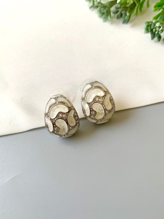 Handcrafted Auralie Studs in rhodium plating with real Mother of Pearl and American Diamonds by Zamal Jewels.