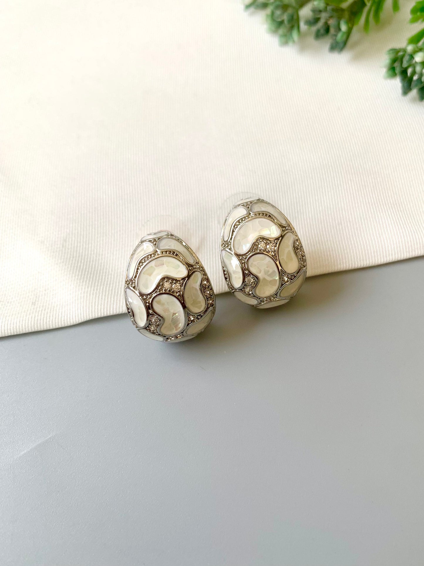 Handcrafted Auralie Studs in rhodium plating with real Mother of Pearl and American Diamonds by Zamal Jewels.