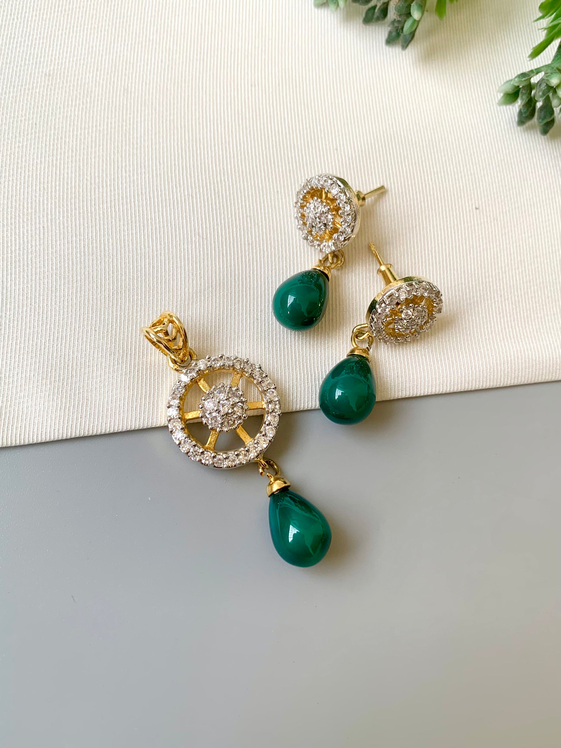 Handcrafted Aveline Pendant Set in 22kt gold plating with high-quality American Diamonds and Semi-Precious Emerald teardrop stones by Zamal Jewels.