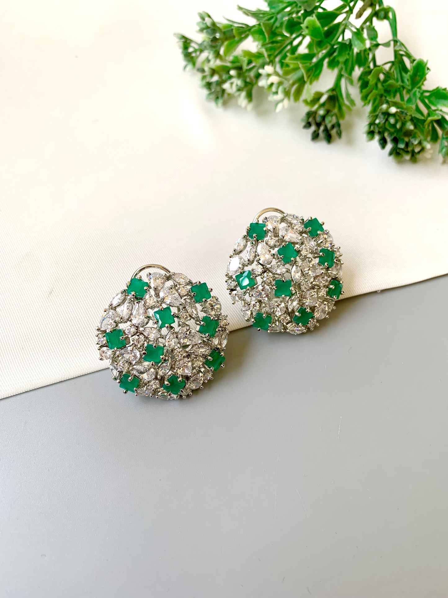 Handcrafted Celesta Studs in Emerald with American Diamonds and rhodium platinum polish — by Zamal Jewels.