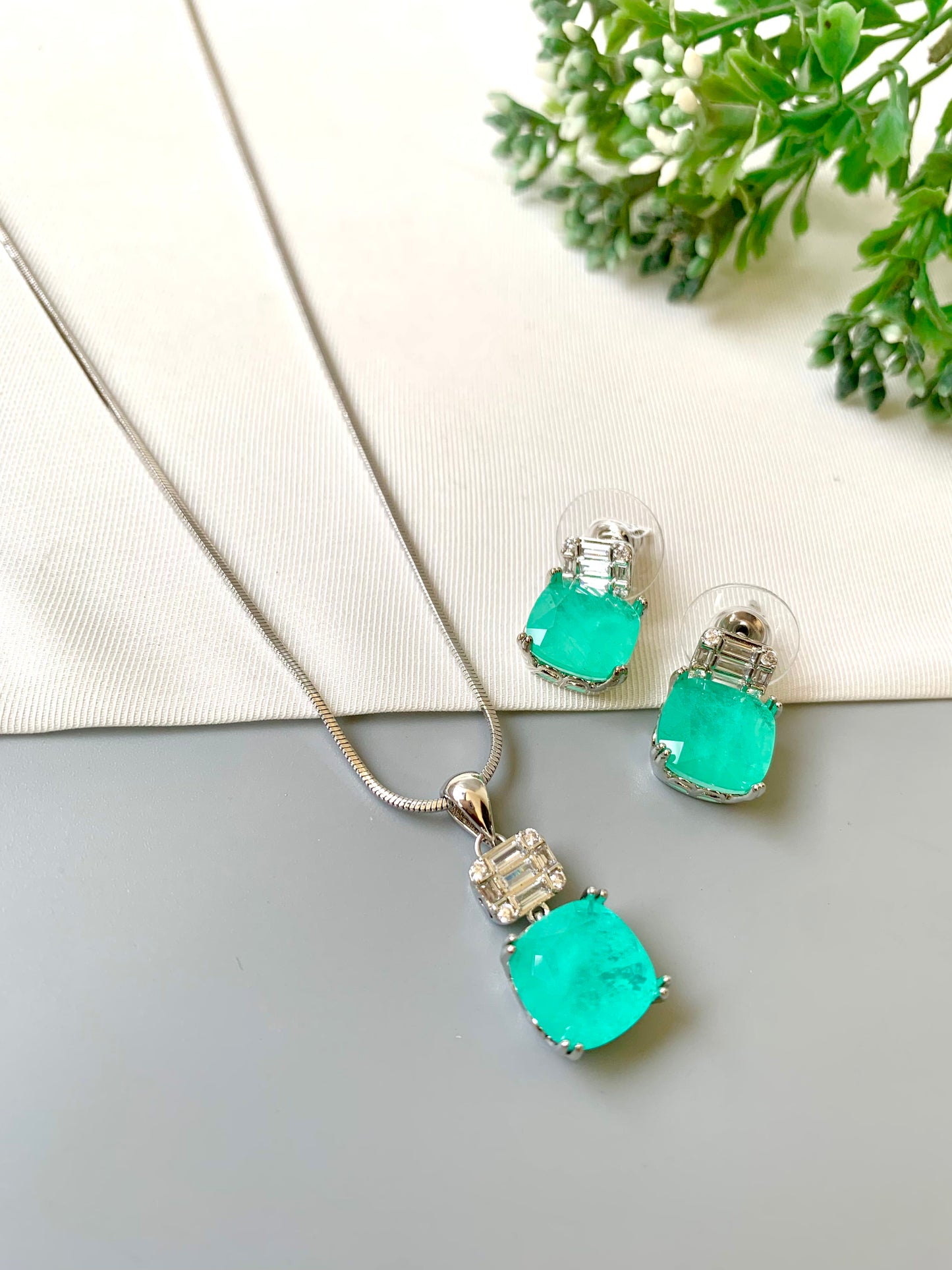 Handcrafted Celise Pendant Set in rhodium plating with Semi-Precious Mint Onyx and American Diamonds — includes chain, pendant, and studs by Zamal Jewels.