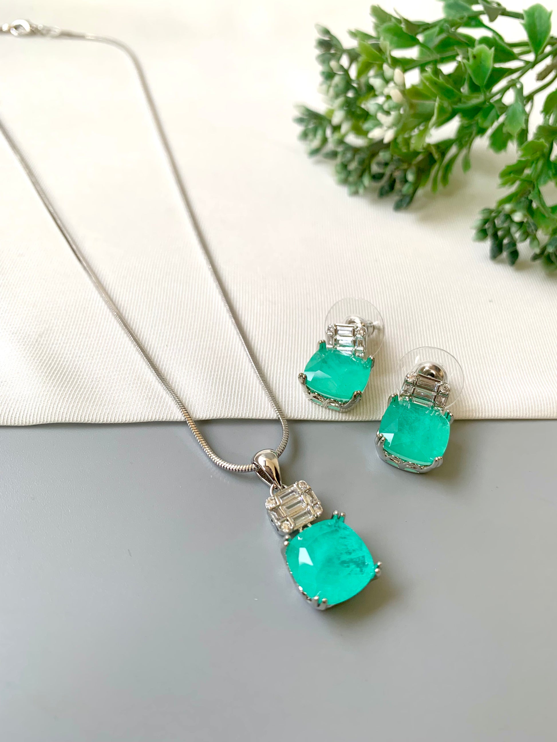 Handcrafted Celise Pendant Set in rhodium plating with Semi-Precious Mint Onyx and American Diamonds — includes chain, pendant, and studs by Zamal Jewels.