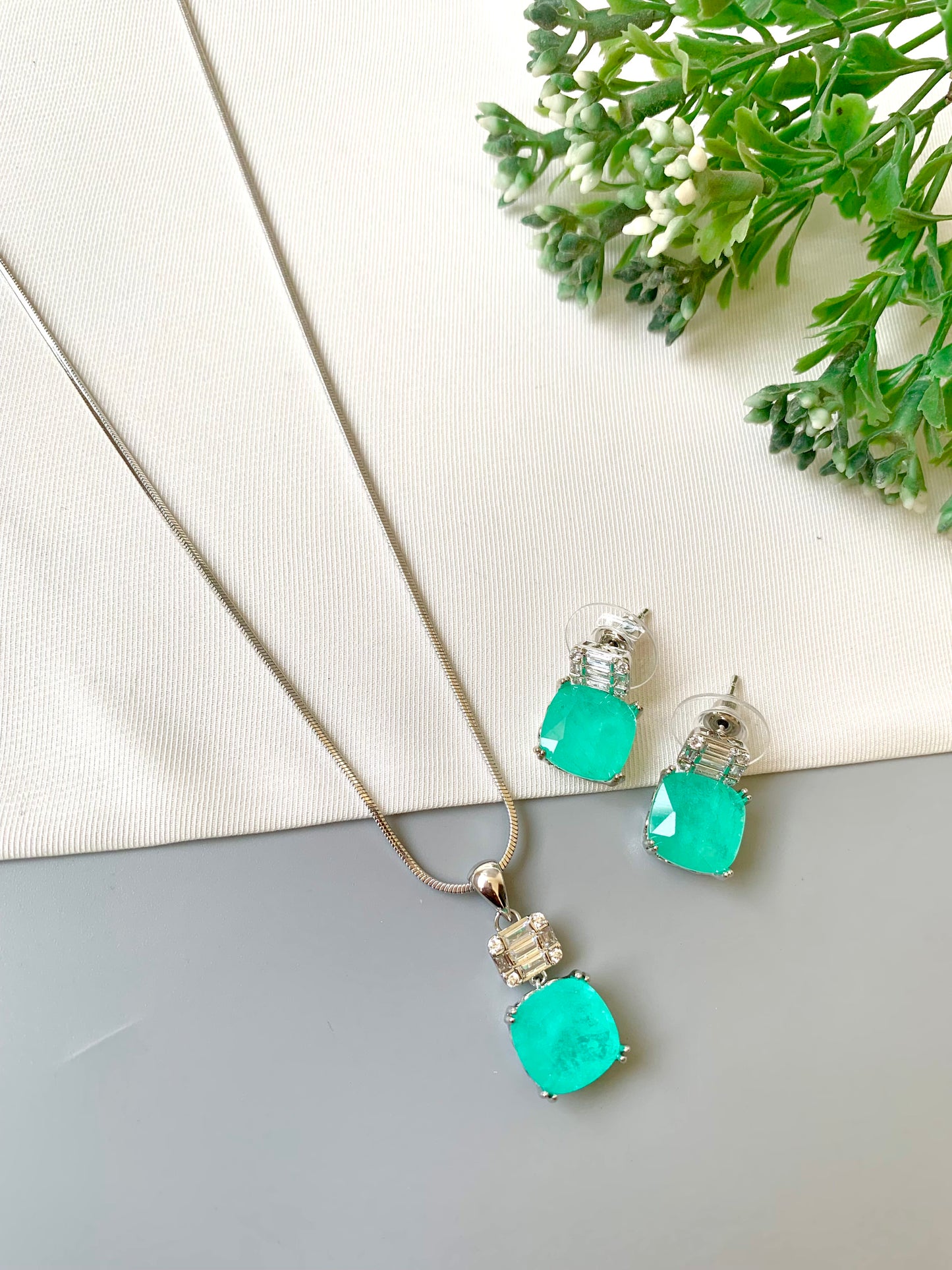 Handcrafted Celise Pendant Set in rhodium plating with Semi-Precious Mint Onyx and American Diamonds — includes chain, pendant, and studs by Zamal Jewels.