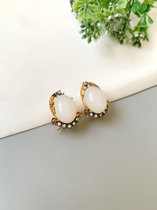 Handcrafted Elara White Zircon Studs in gold plating with oval zircon stones by Zamal Jewels.