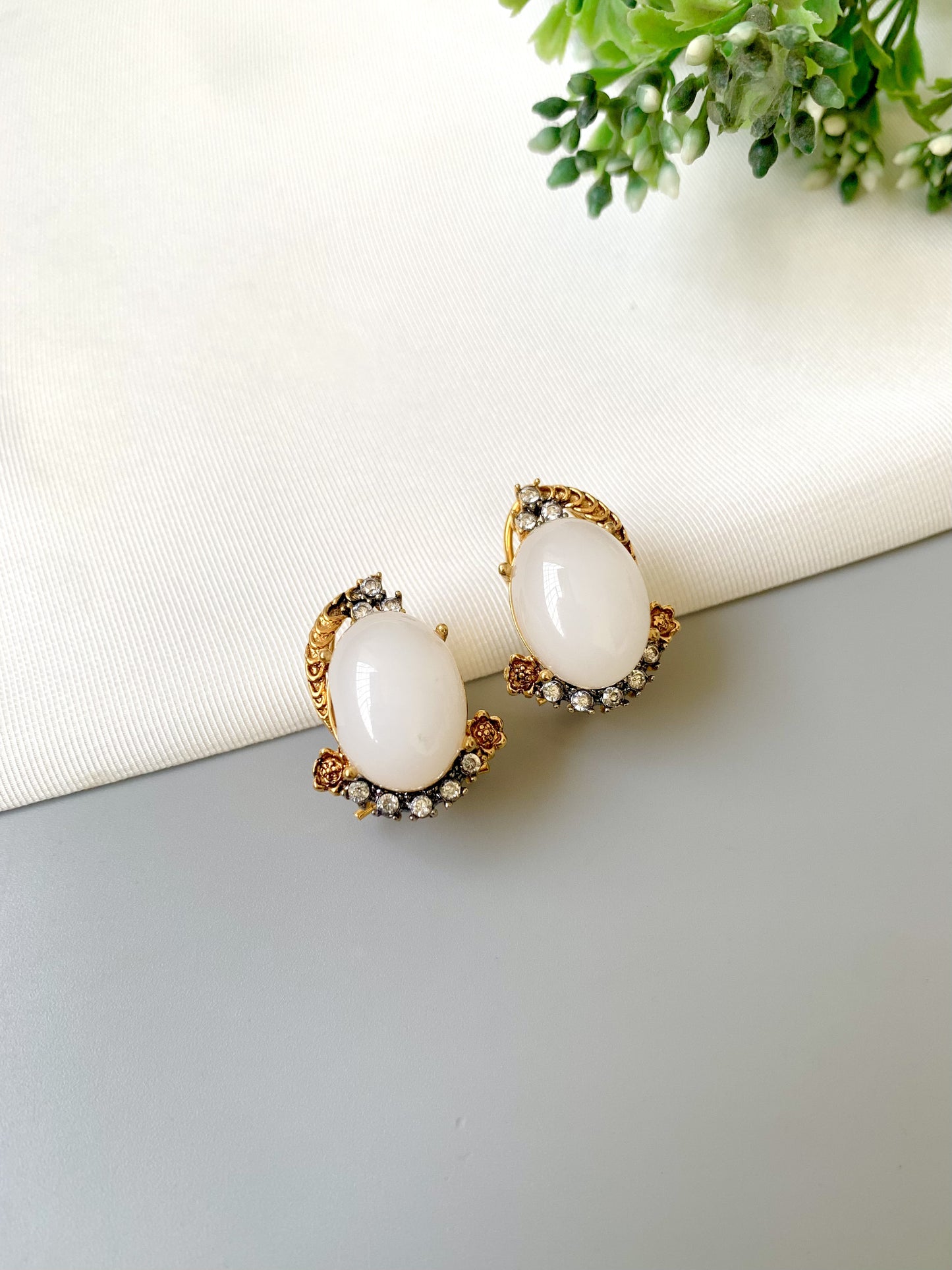 Handcrafted Elara White Zircon Studs in gold plating with oval zircon stones by Zamal Jewels.
