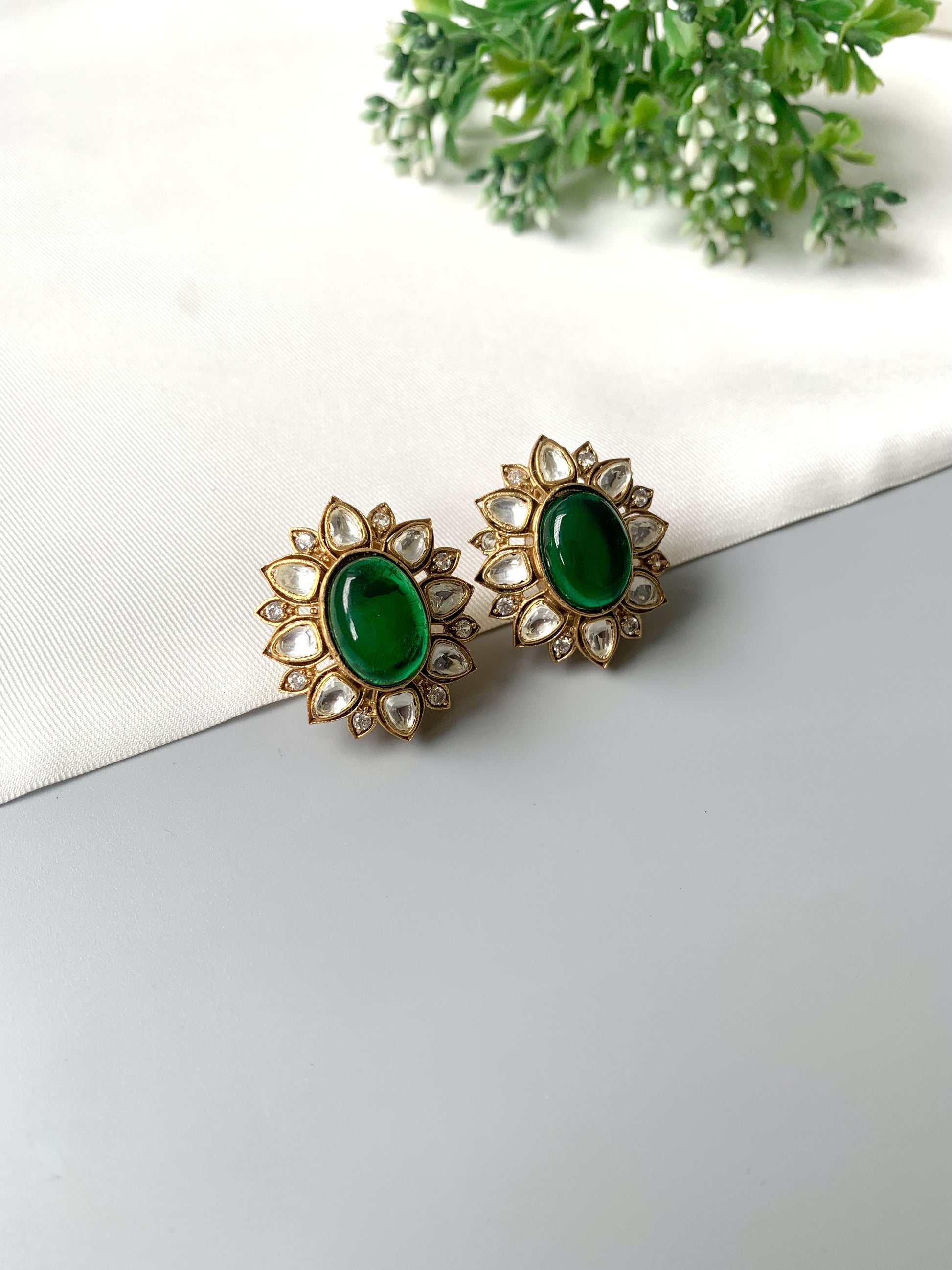 Handcrafted Eloria Emerald Studs with semi-precious emerald center, Polki Kundan, American Diamonds, and 22kt gold plating – Zamal Jewels