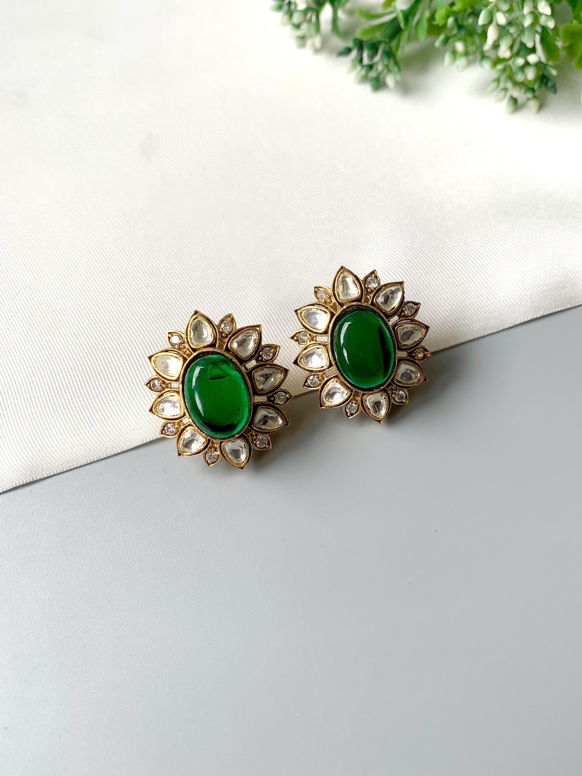 Handcrafted Eloria Emerald Studs with semi-precious emerald center, Polki Kundan, American Diamonds, and 22kt gold plating – Zamal Jewels