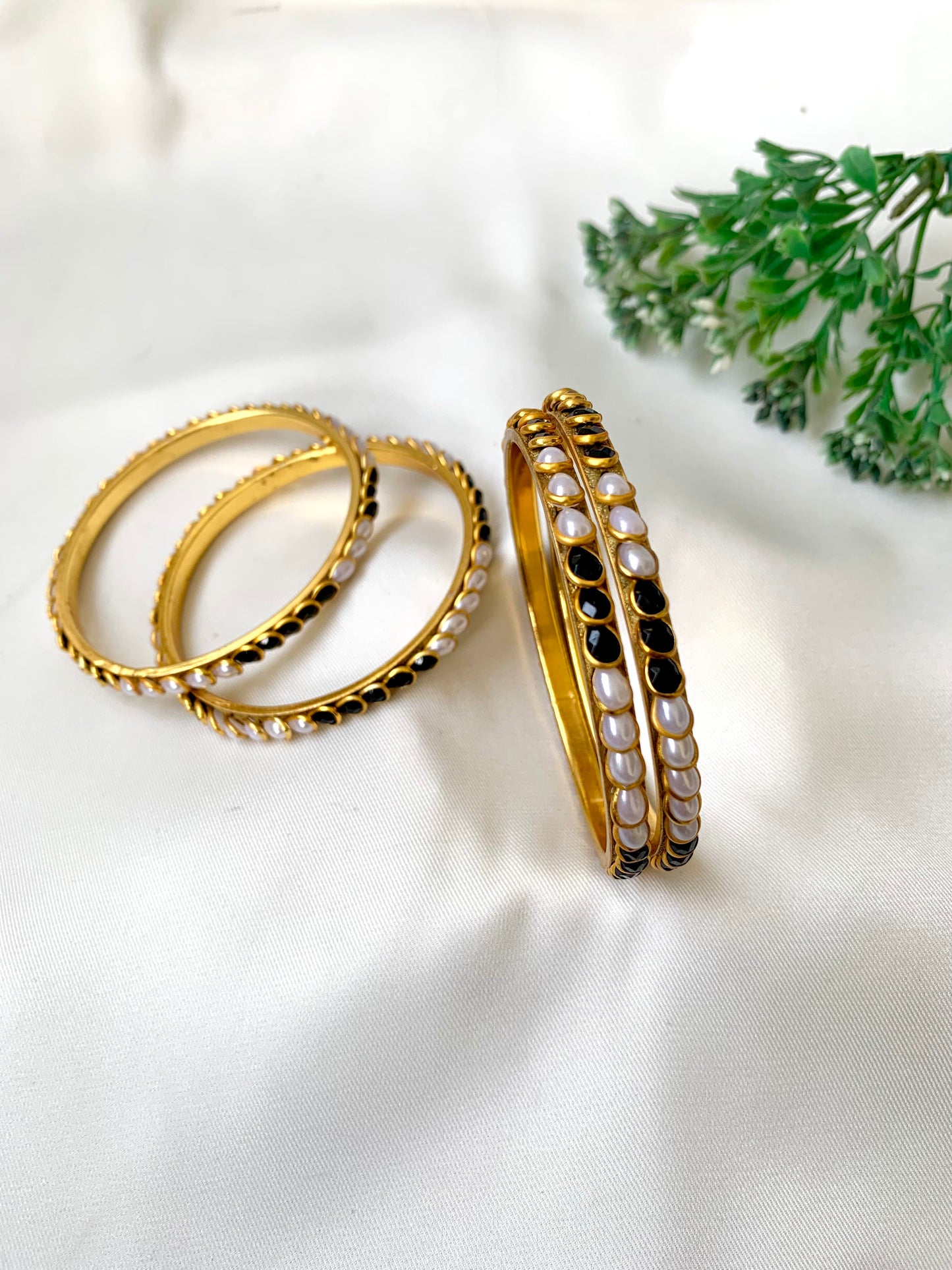 Handcrafted Inaya Bangles in 22kt gold plating with Onyx and Pearls — set of 4 bangles by Zamal Jewels.