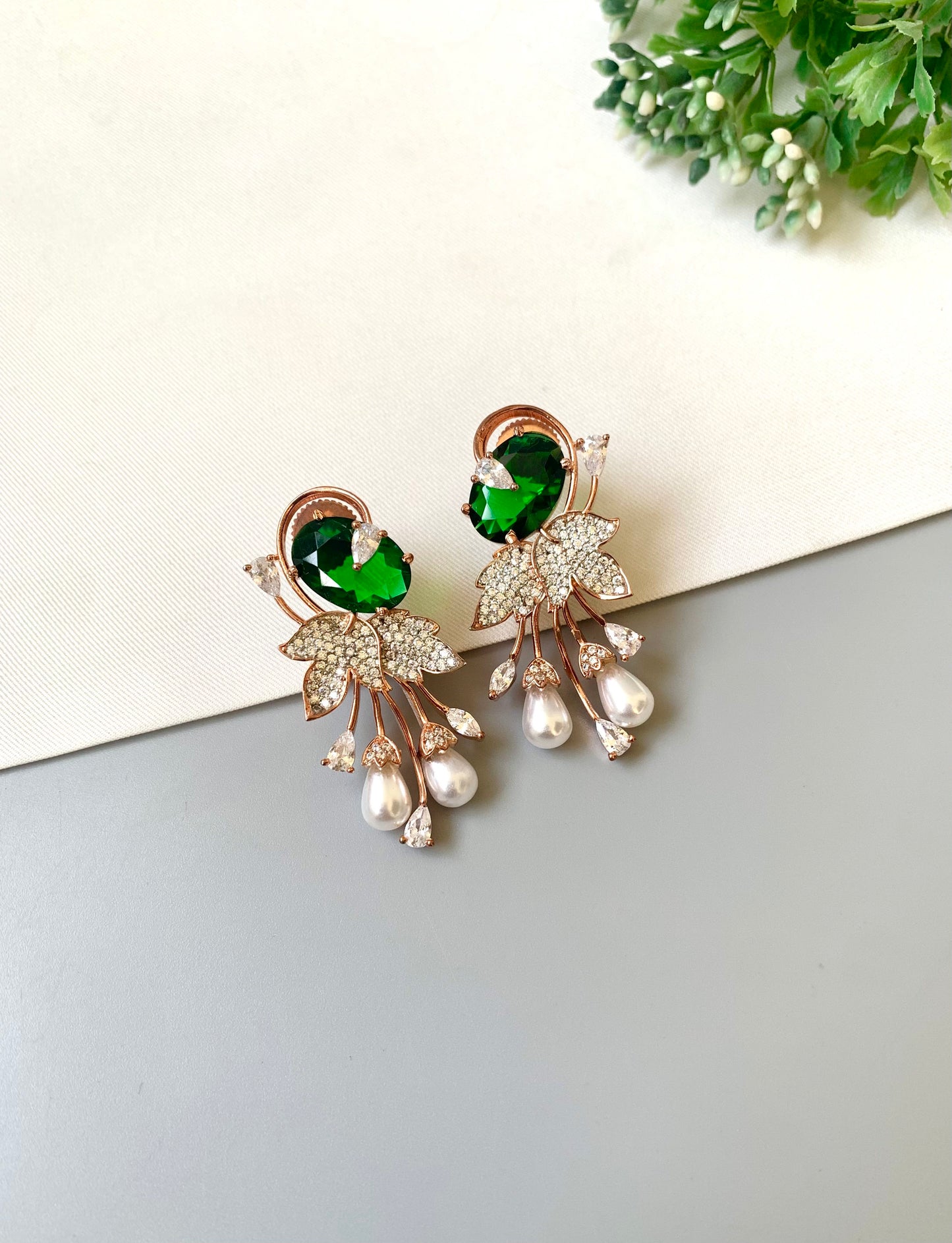 Handcrafted rose gold plated emerald drop earrings with American diamonds, onyx and pearls by Zamal Jewels