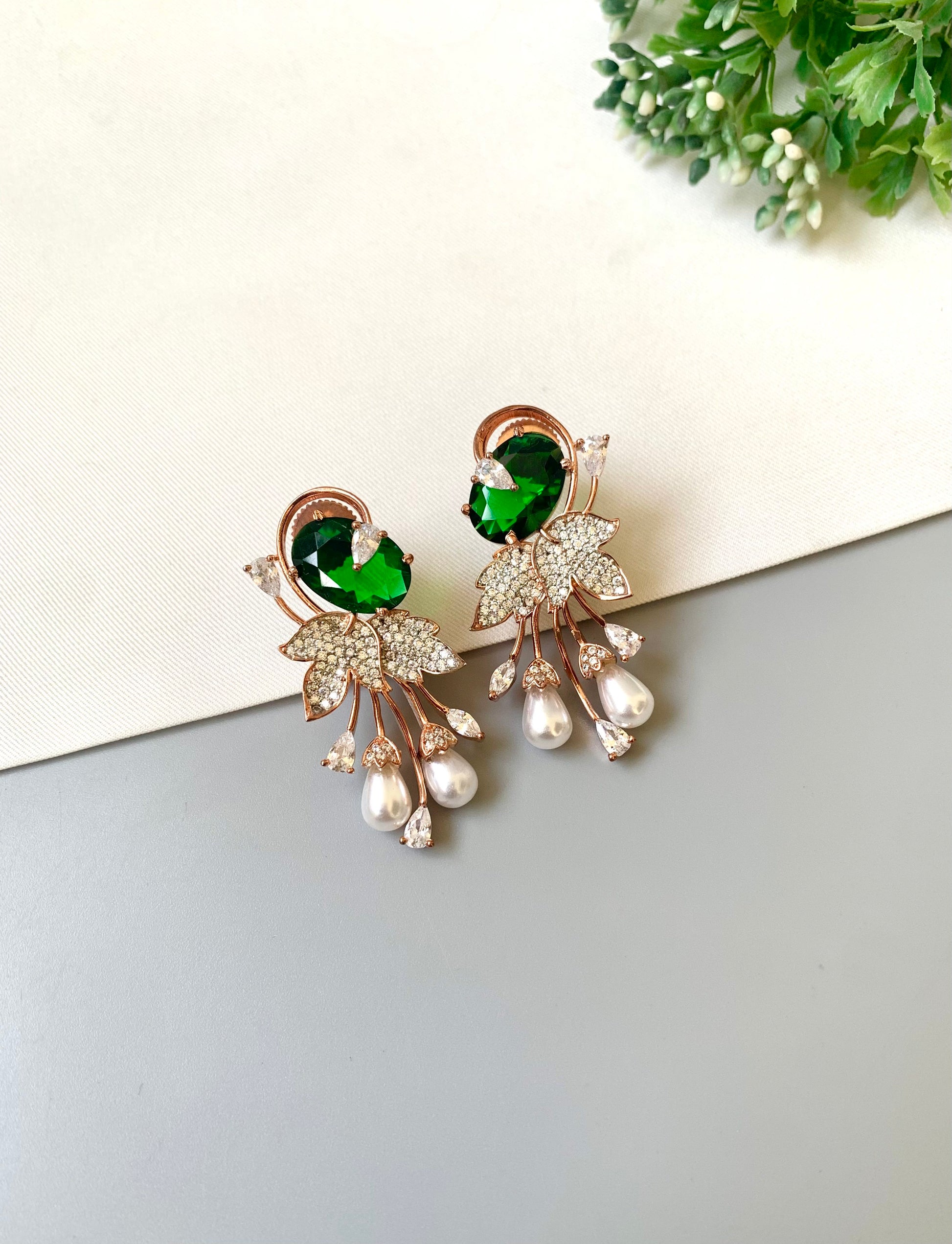 Handcrafted rose gold plated emerald drop earrings with American diamonds, onyx and pearls by Zamal Jewels