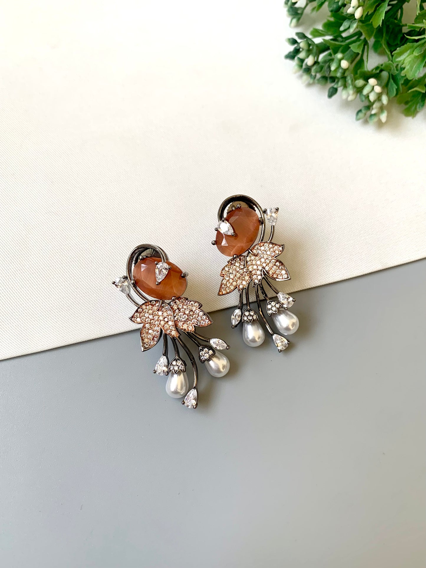 Handcrafted rose gold plated drop earrings with American diamonds, onyx and pearls – orange variant by Zamal Jewels