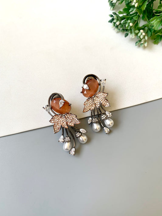 Handcrafted rose gold plated drop earrings with American diamonds, onyx and pearls – orange variant by Zamal Jewels