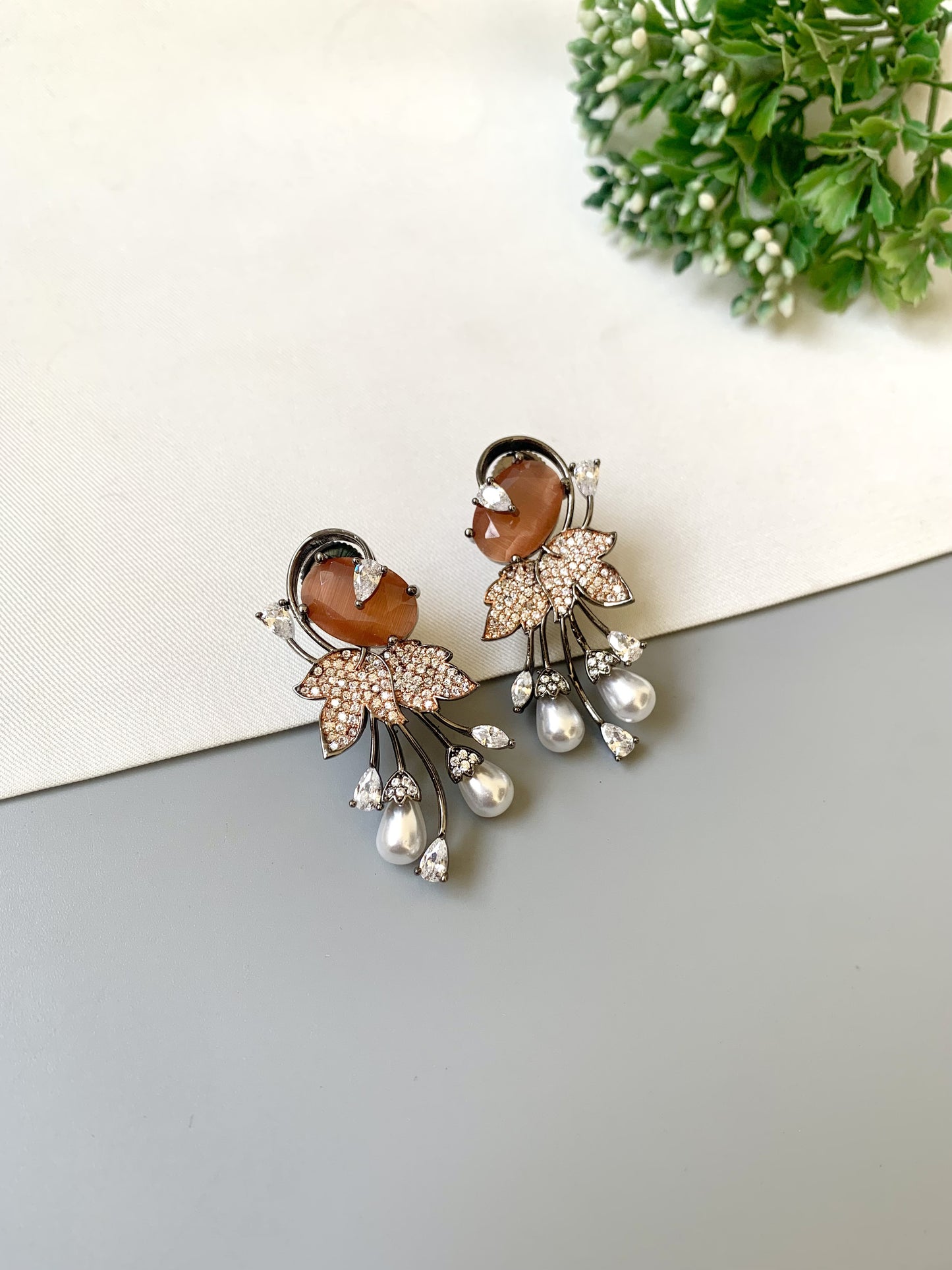Handcrafted rose gold plated drop earrings with American diamonds, onyx and pearls – orange variant by Zamal Jewels