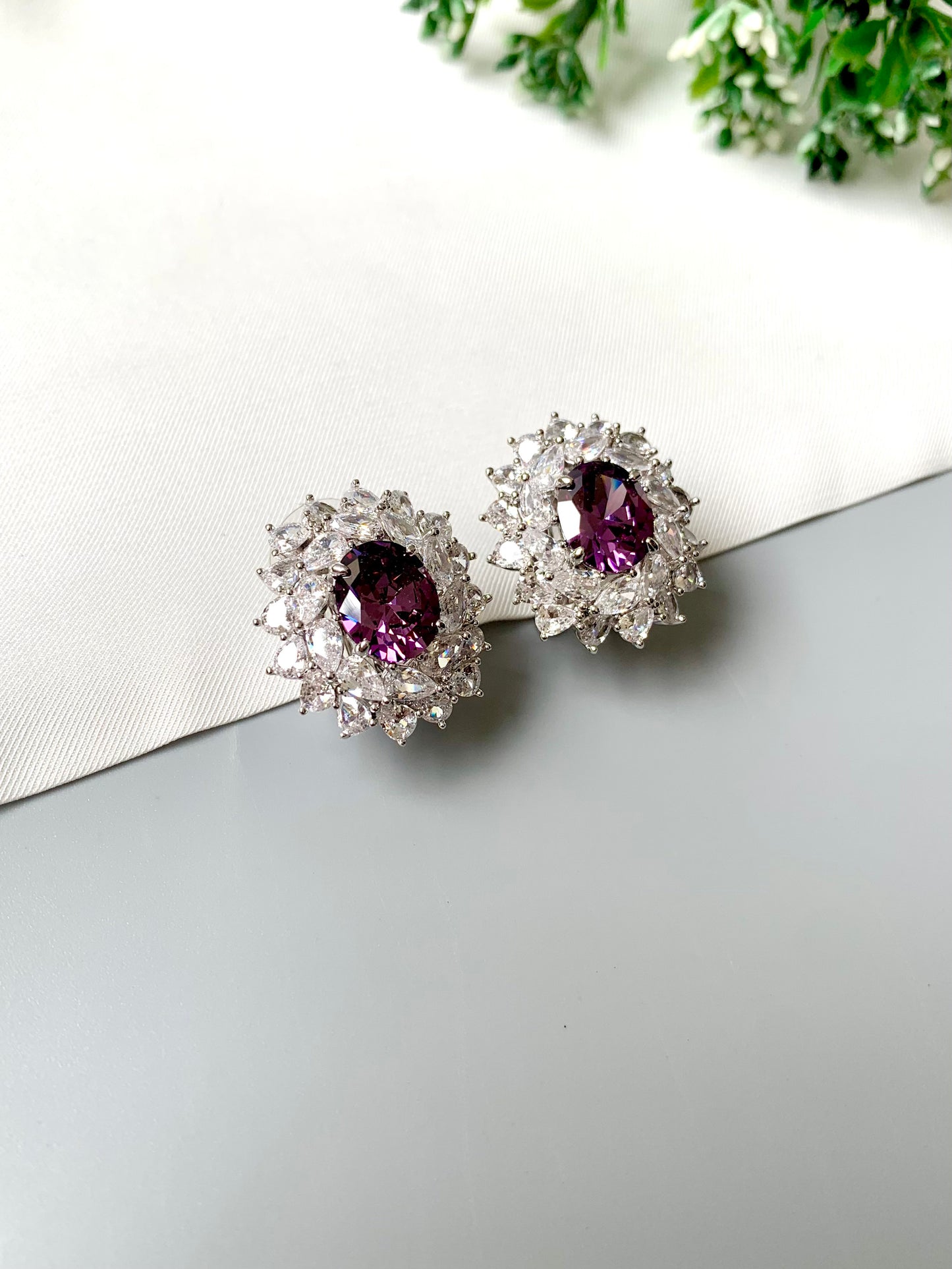 Hand crafted rhodium plated studs in platinum finish featuring semi-precious amethyst and American Diamonds by Zamal Jewels