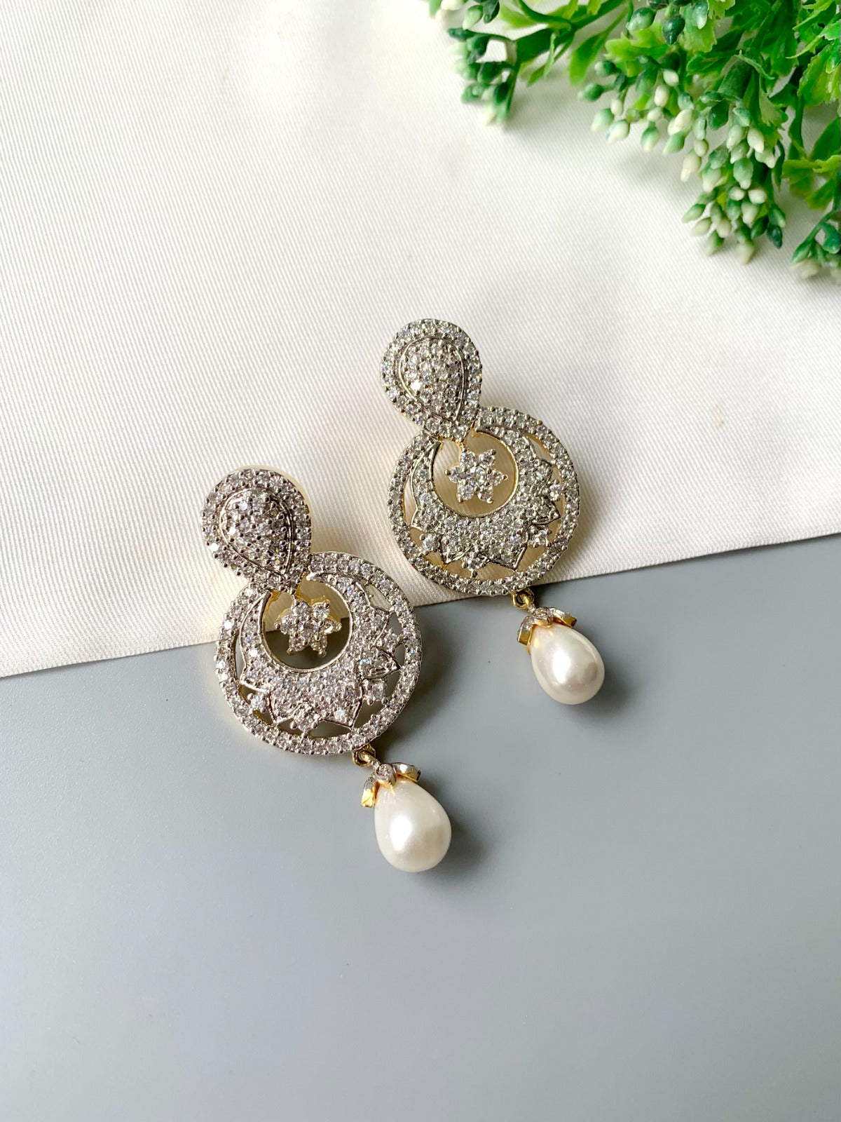 Handcrafted pearl drop earrings with American Diamonds in 22kt gold plating by Zamal Jewels