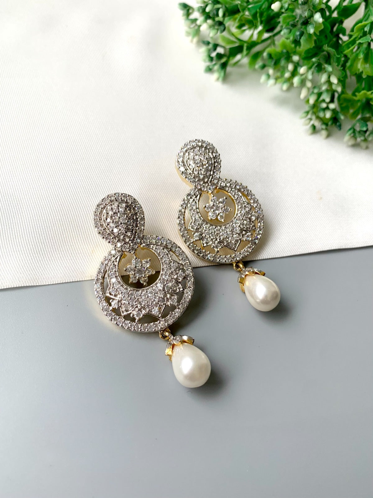 Handcrafted pearl drop earrings with American Diamonds in 22kt gold plating by Zamal Jewels