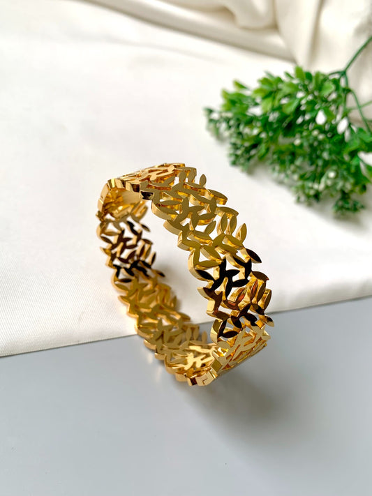 Gold-plated openable bracelet with leaf cut-out design, made from 316L stainless steel – waterproof & tarnish-proof by Zamal Jewels.