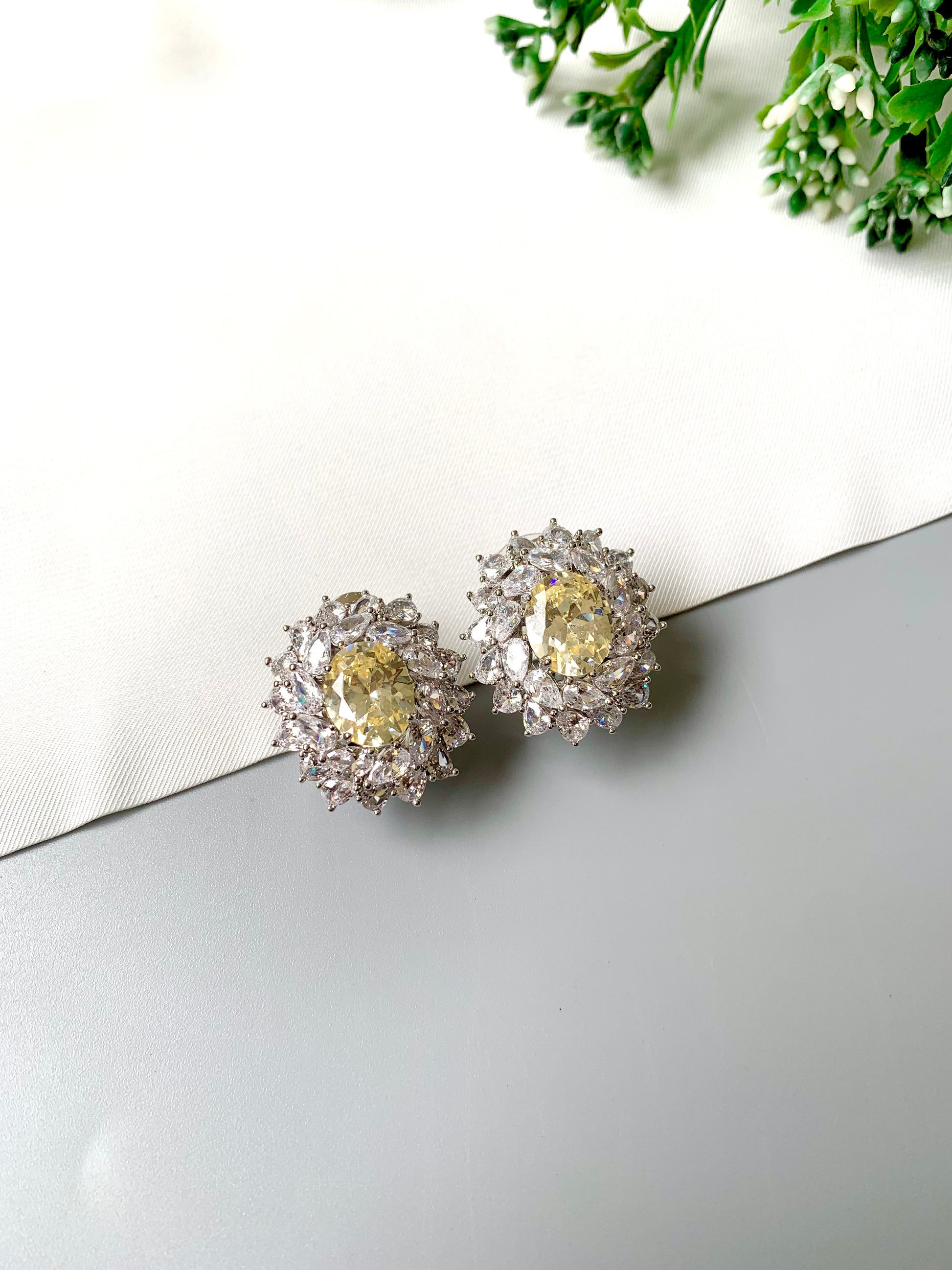 Handcrafted rhodium plated stud earrings with semi-precious Citrine center stone and American Diamonds in platinum finish, by Zamal Jewels
