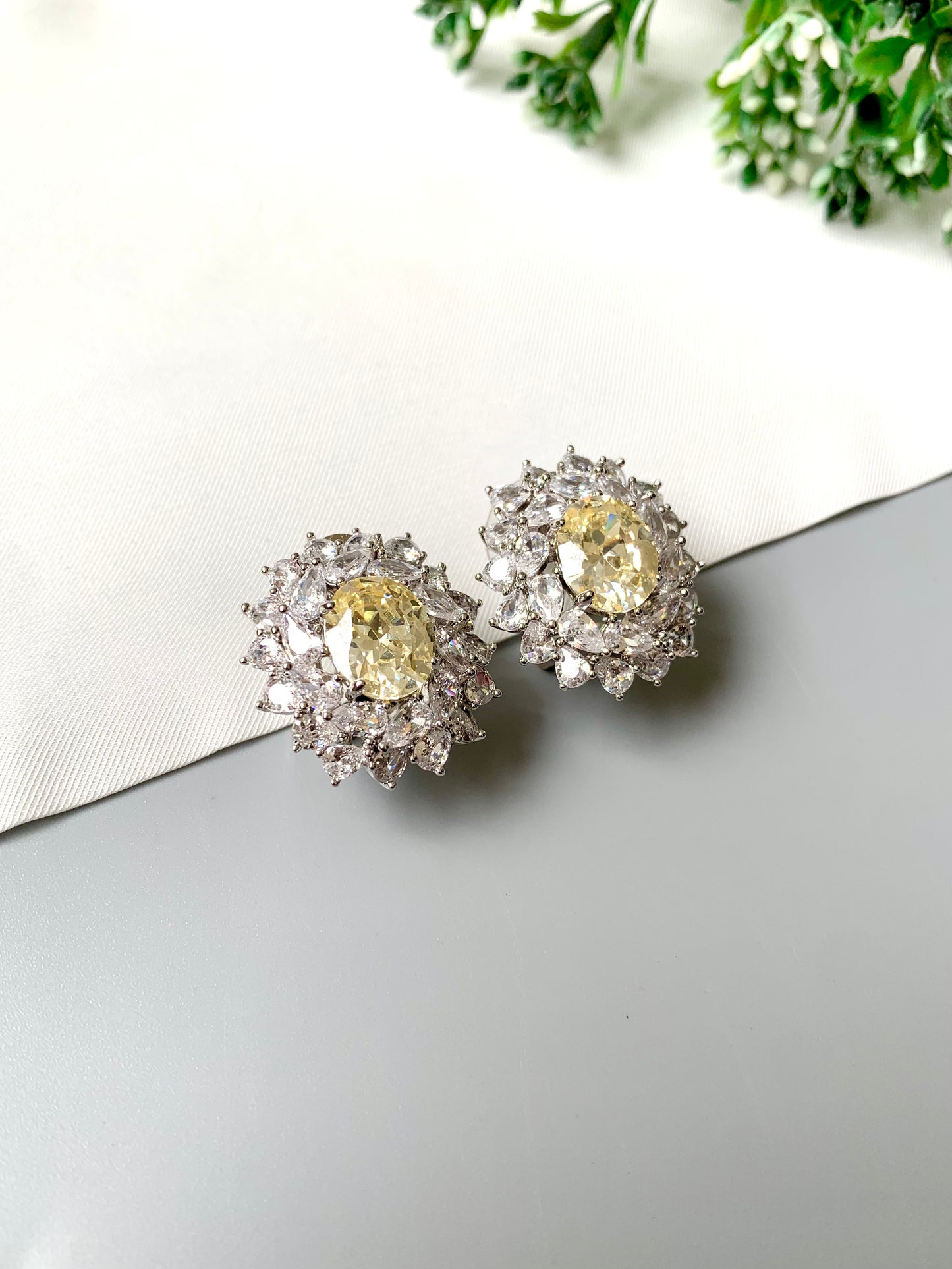 Handcrafted rhodium plated stud earrings with semi-precious Citrine center stone and American Diamonds in platinum finish, by Zamal Jewels