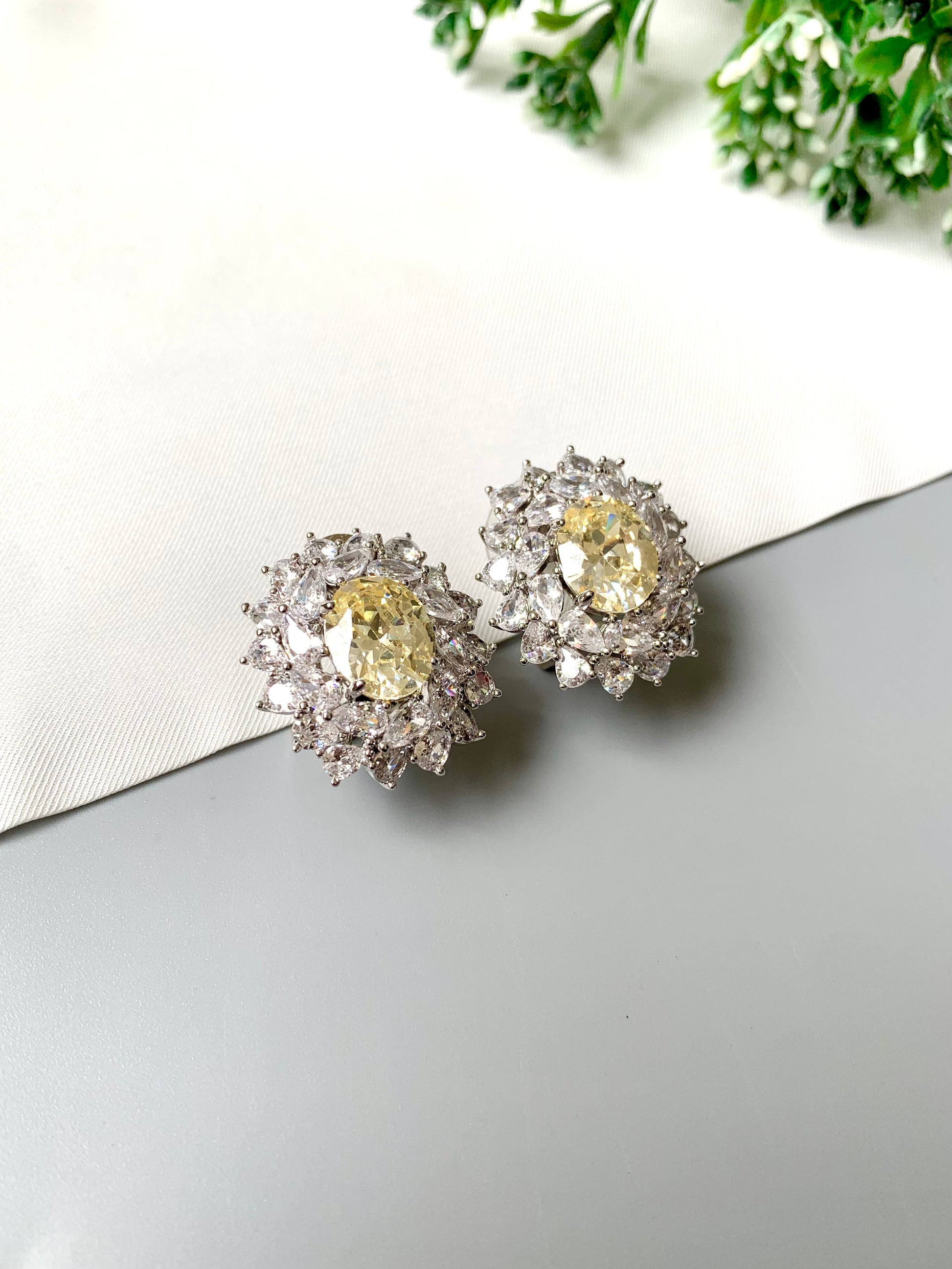 Handcrafted rhodium plated stud earrings with semi-precious Citrine center stone and American Diamonds in platinum finish, by Zamal Jewels