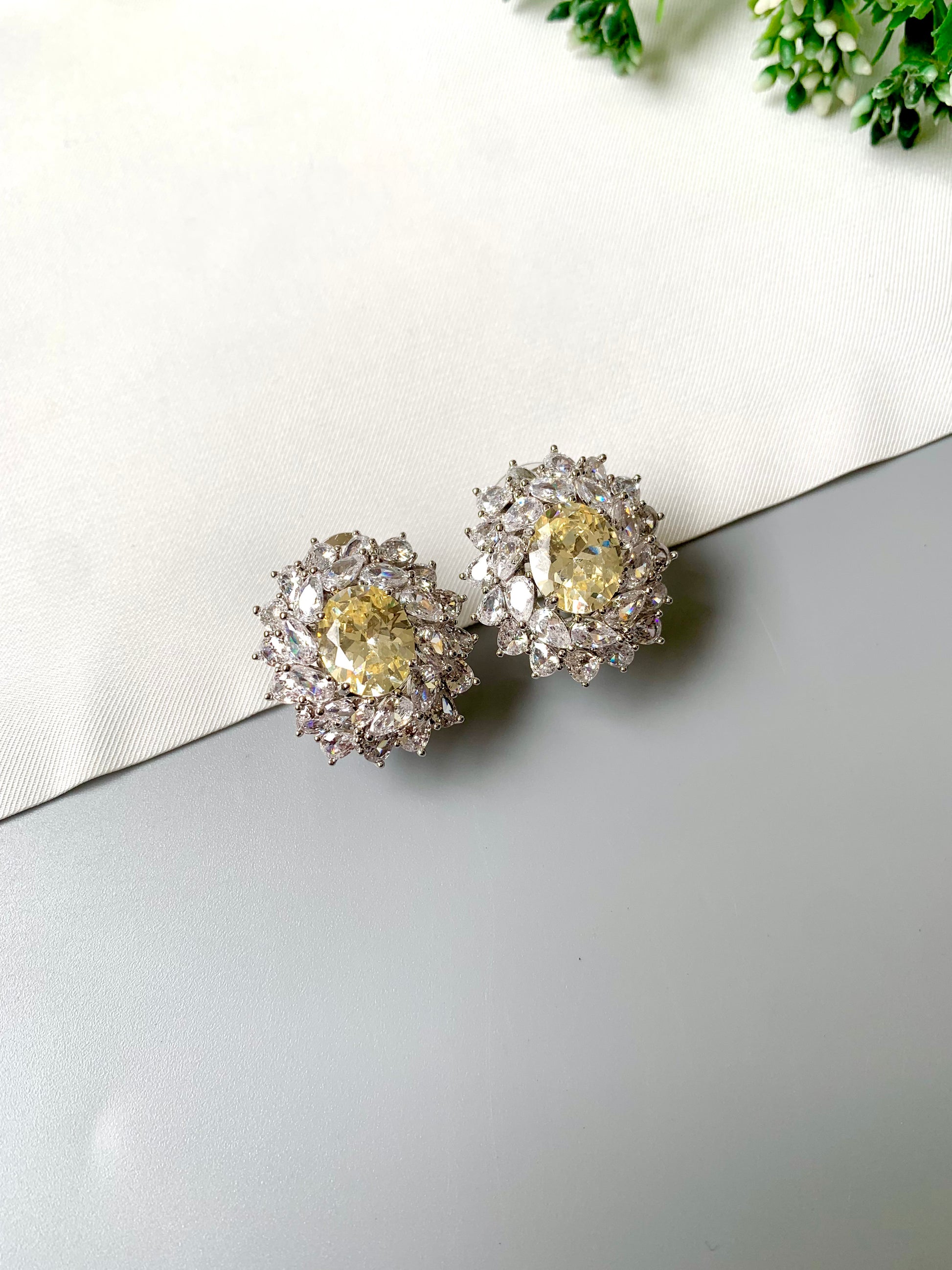 Handcrafted rhodium plated stud earrings with semi-precious Citrine center stone and American Diamonds in platinum finish, by Zamal Jewels