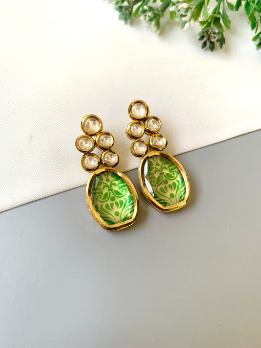 Handcrafted Mehira Earrings in emerald with Polki Bikaneri Kundan and hand-painted Meena — 22kt gold plated by Zamal Jewels.