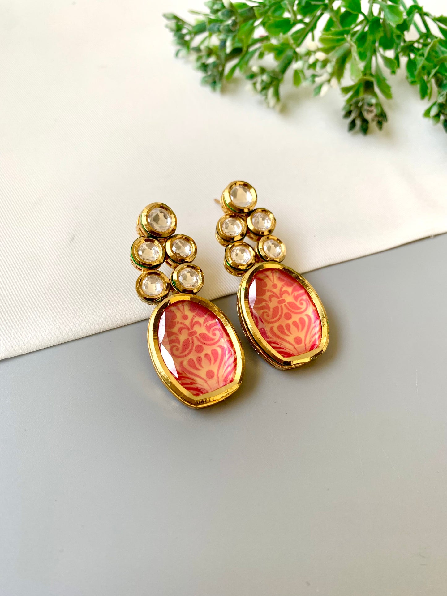 Handcrafted Mehira Earrings in pink with Polki Bikaneri Kundan and hand-painted Meena — 22kt gold plated by Zamal Jewels.