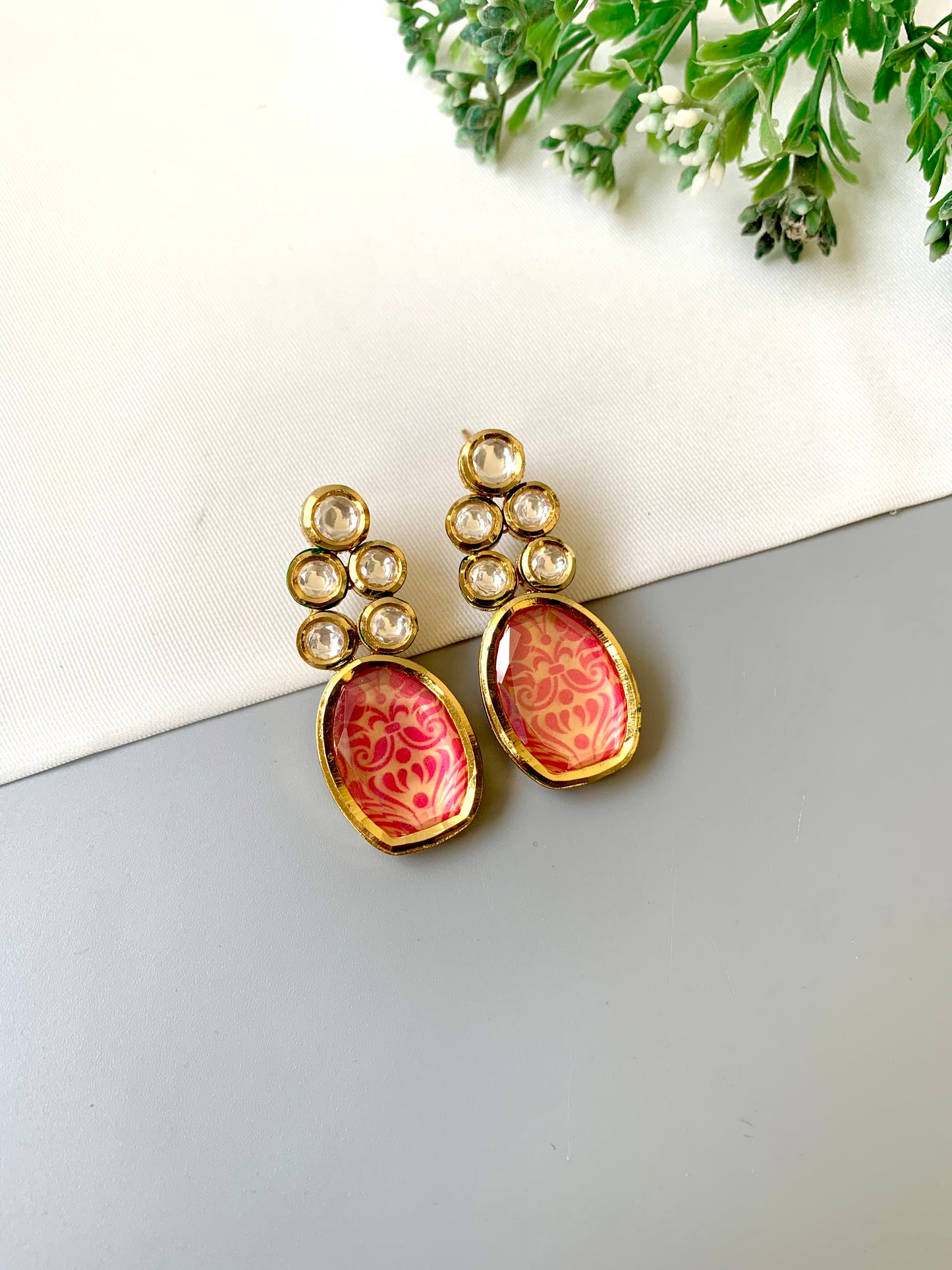 Handcrafted Mehira Earrings in pink with Polki Bikaneri Kundan and hand-painted Meena — 22kt gold plated by Zamal Jewels.