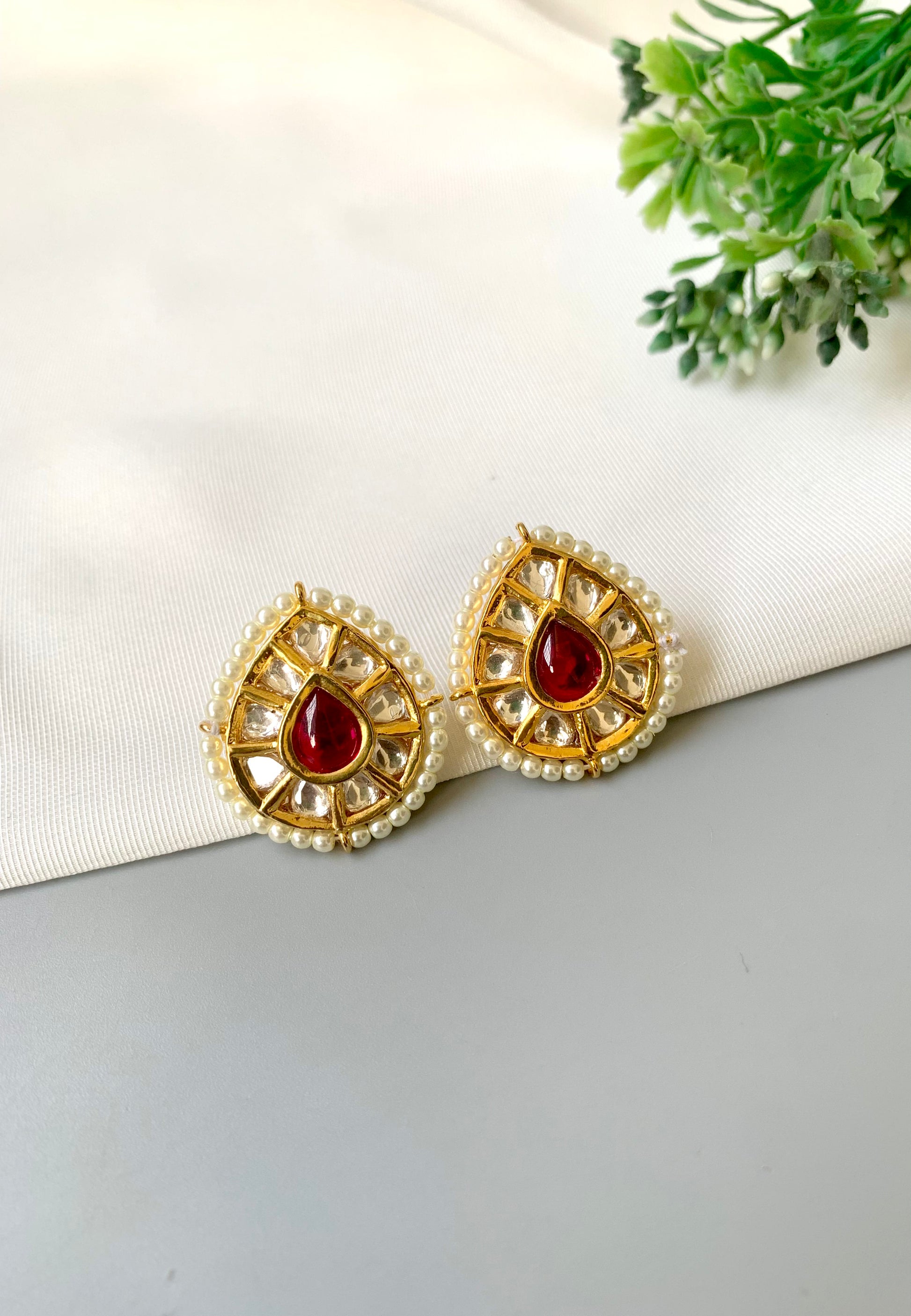 Handcrafted Mehreen Ruby Studs in 22kt gold plating with Polki Kundan, pearls, and hand-painted Meena work by Zamal Jewels.