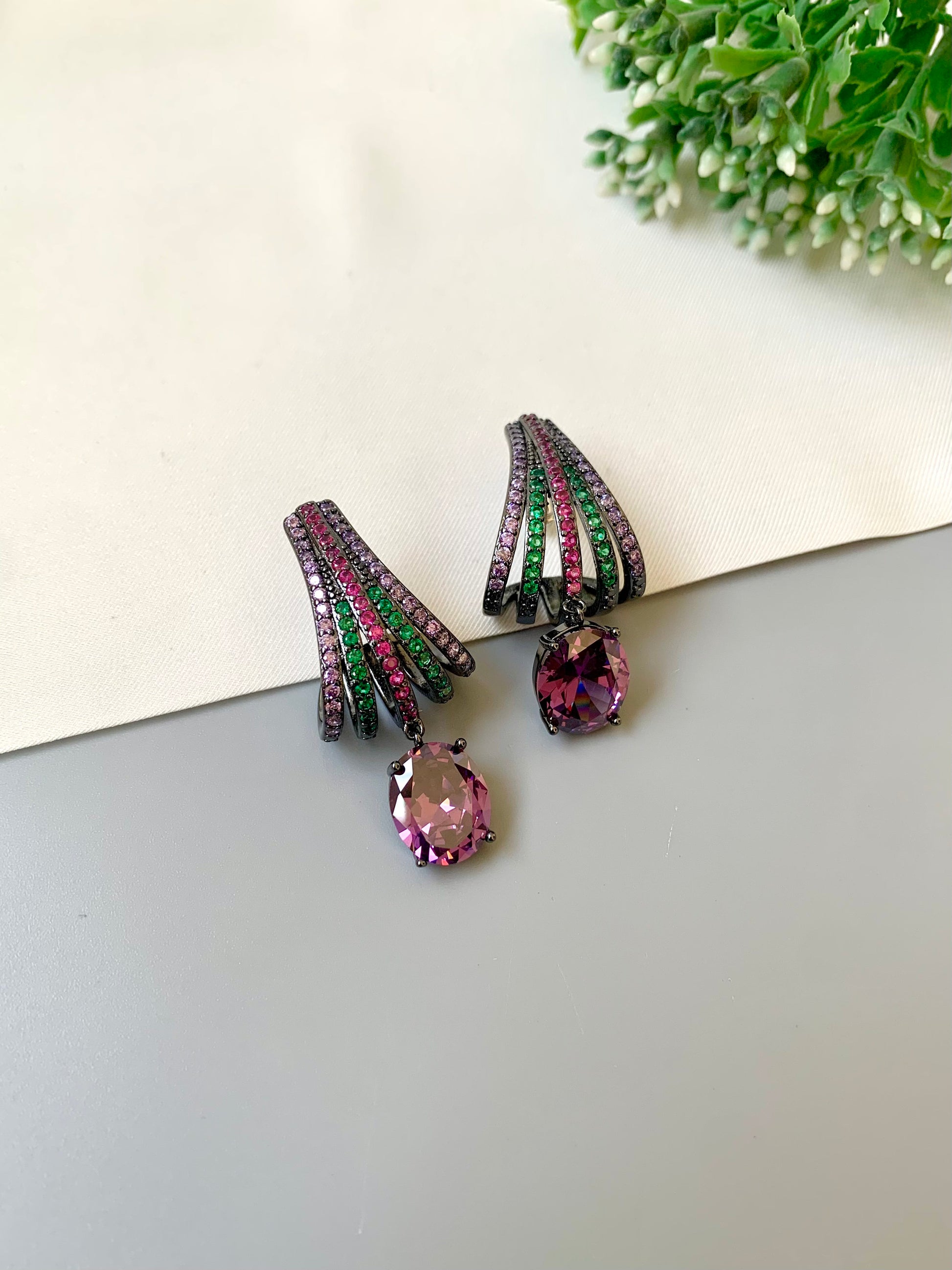 Handcrafted rhodium plated oxidized earrings with American diamonds and ruby emerald amethyst stones