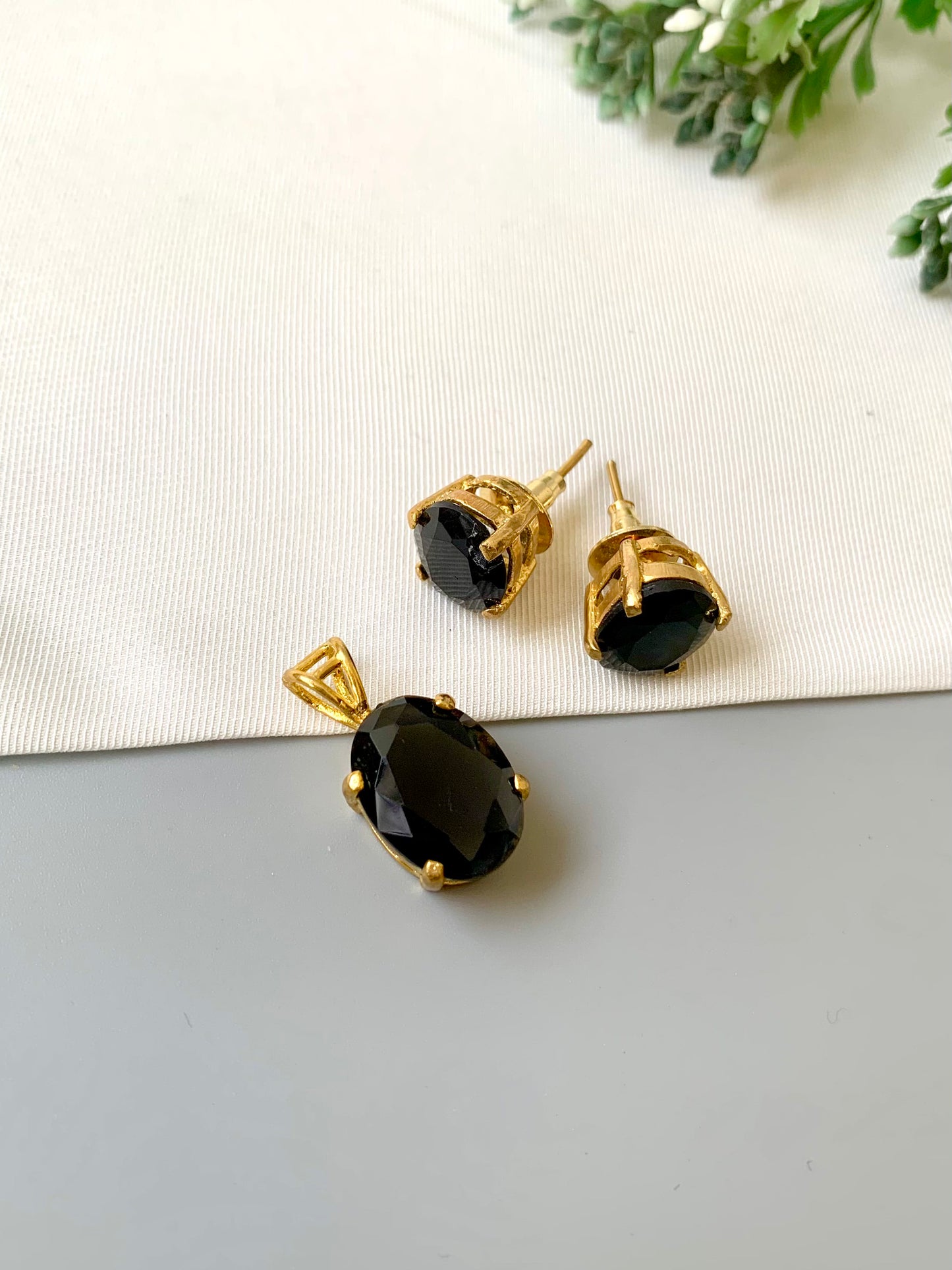 Handcrafted Nerra Pendant Set in 22kt gold plating with high-quality Onyx stones — pendant and earrings by Zamal Jewels.