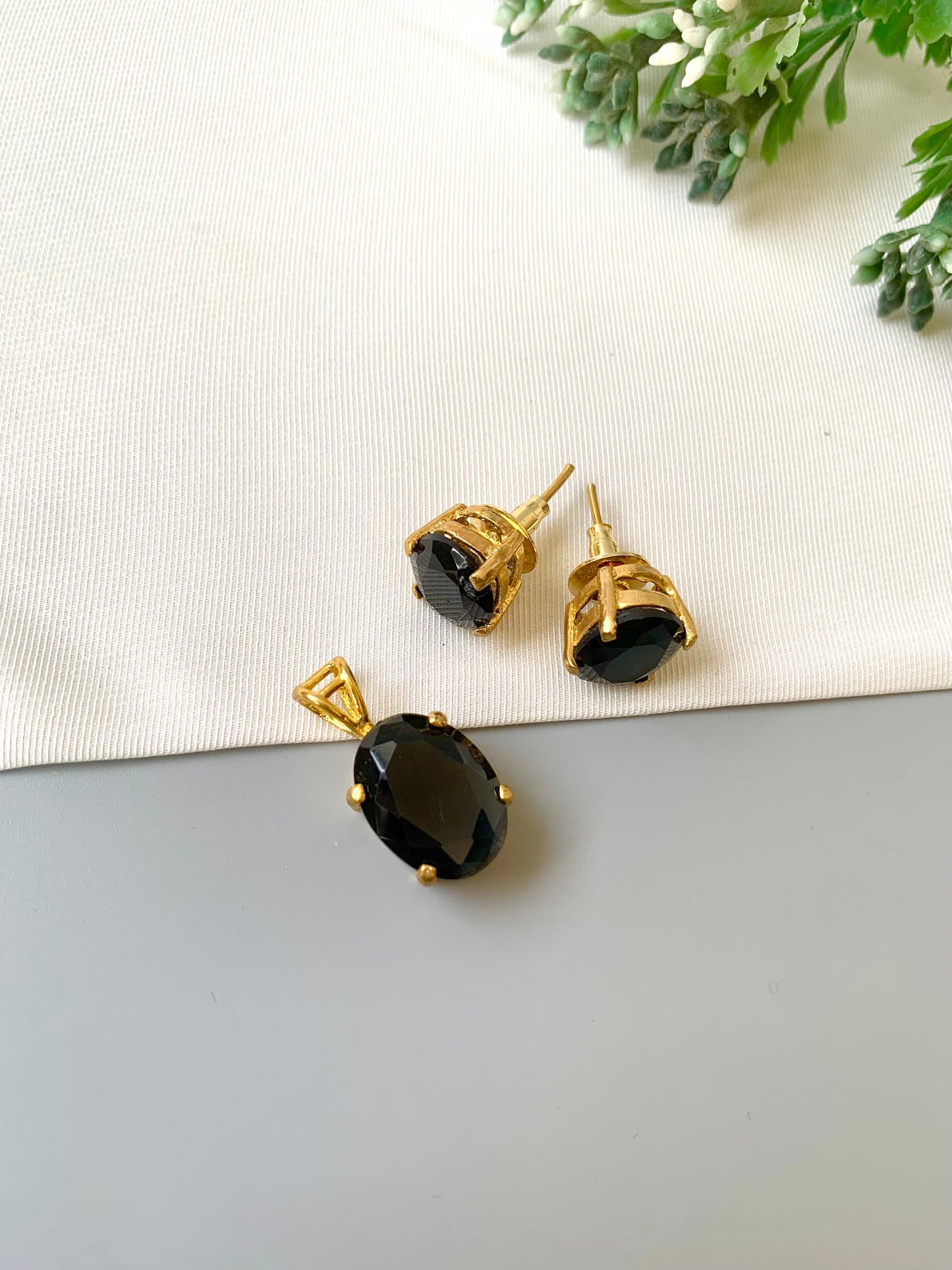 Handcrafted Nerra Pendant Set in 22kt gold plating with high-quality Onyx stones — pendant and earrings by Zamal Jewels.
