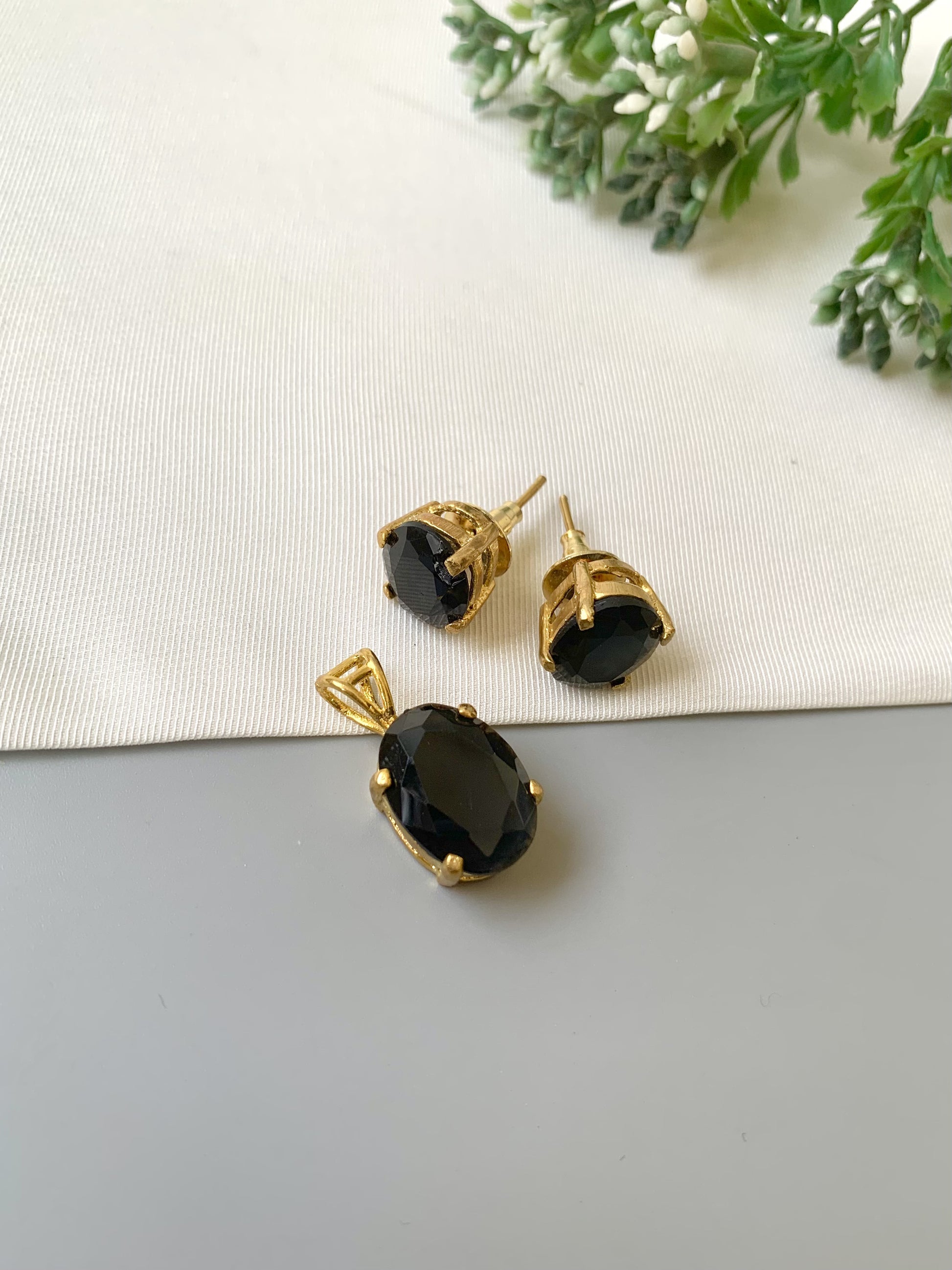Handcrafted Nerra Pendant Set in 22kt gold plating with high-quality Onyx stones — pendant and earrings by Zamal Jewels.