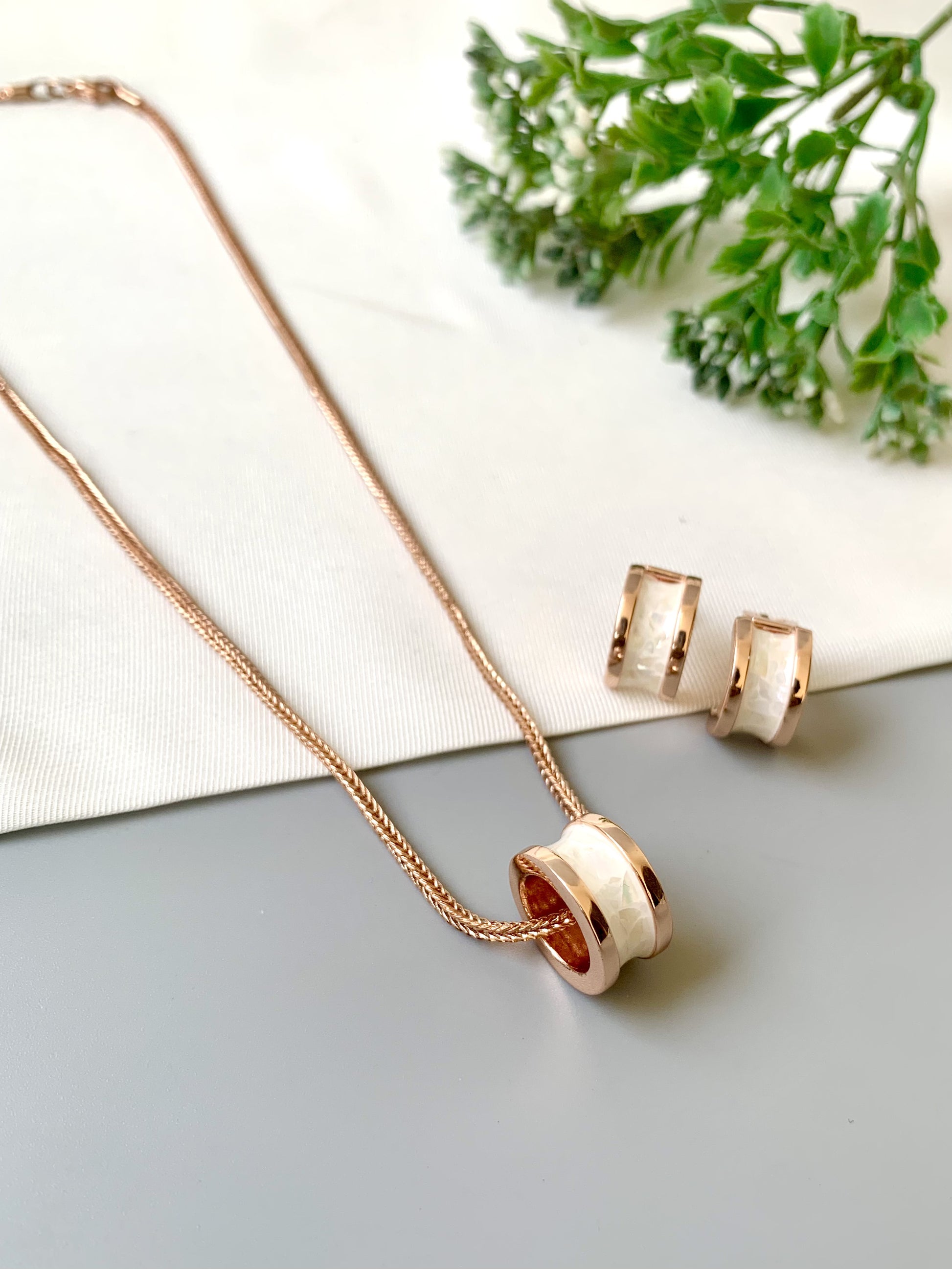 Handcrafted Noira Pendant Set in 22kt rose gold plating with real Mother of Pearl — by Zamal Jewels.