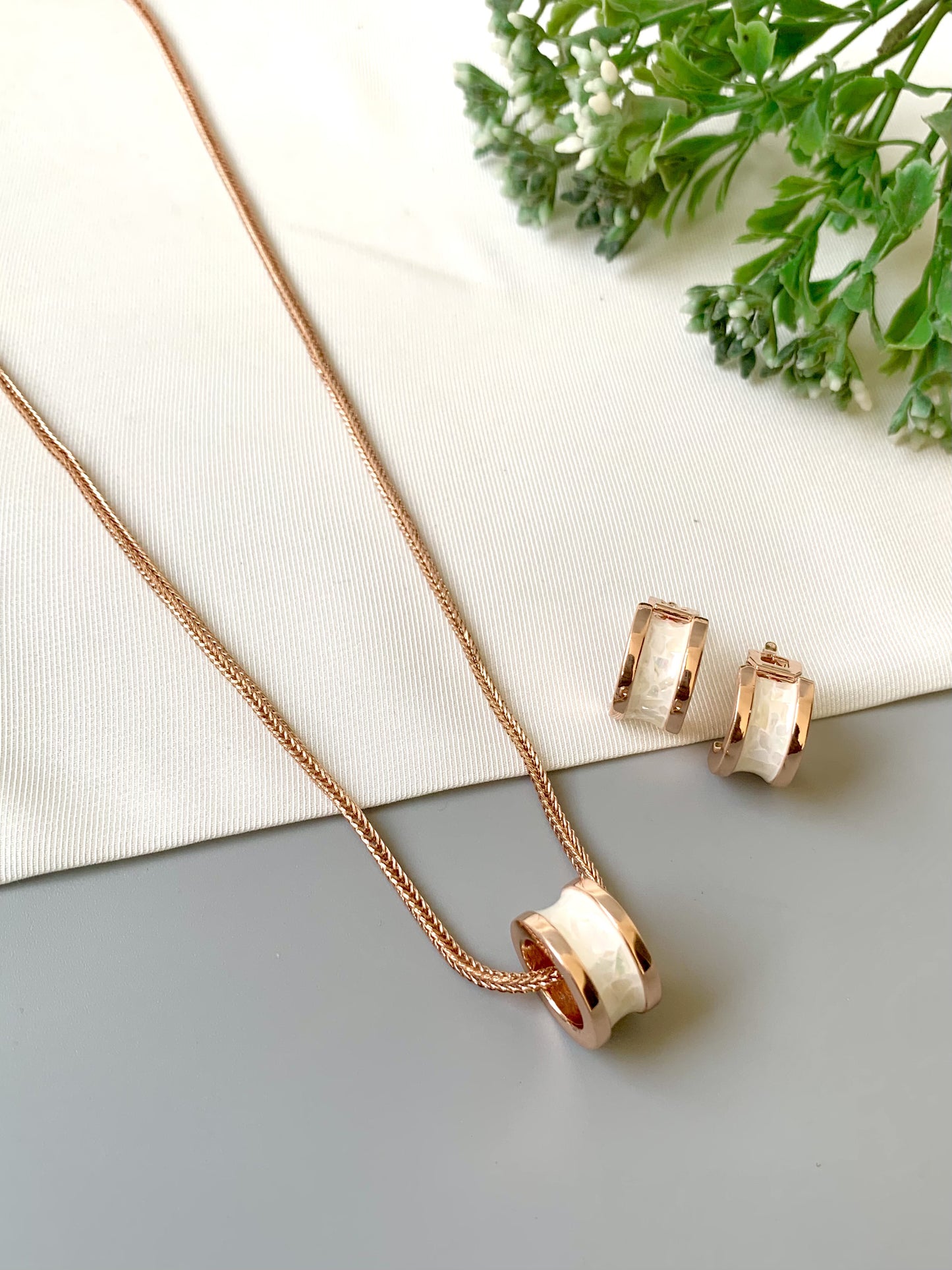 Handcrafted Noira Pendant Set in 22kt rose gold plating with real Mother of Pearl — by Zamal Jewels.